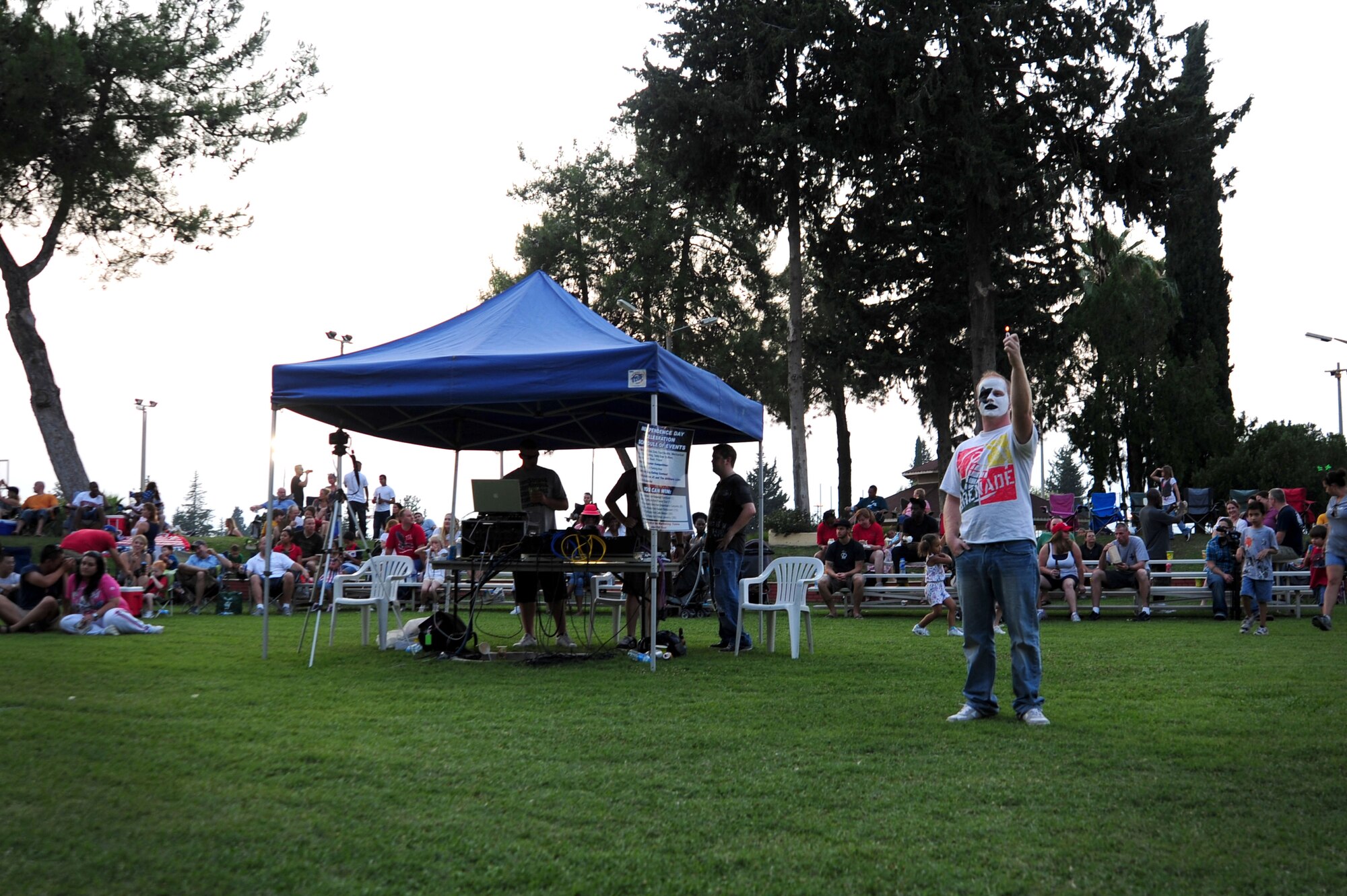 Senior Airman Patrick Allen, from the 39th Maintenance Squadron, raises his lighter while hard-rock band Matthew JC and the AllStars perform during an the Independence Day celebration July 2, 2011, at Arkadas Park, Incirlik Air Base, Turkey. Team Incirlik celebrated Independence Day with various activities, food and live entertainment. (U.S. Air Force photo by Senior Airman Anthony Sanchelli/Released)
