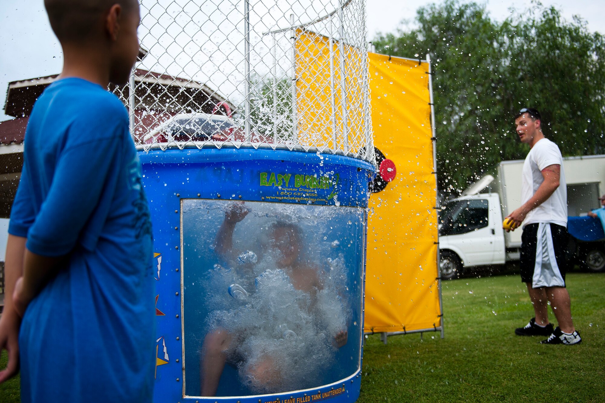 A child splashes in the dunk tank during an Independence Day celebration July 2, 2011, at Arkadas Park, Incirlik Air Base, Turkey. The activities included competitions, food and live entertainment.. (U.S. Air Force photo by Tech. Sgt. Michael B. Keller/Released)