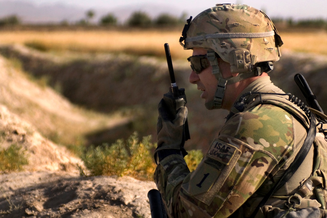 U.S. Army 2nd Lt. Jeffrey Buchheim radios headquarters to send an explosive ordinance disposal team after finding an improvised explosive device in the city of Jamal in Afghanistan's Ghazni province, June 29, 2011. Buchheim is assigned to the 1st Infantry Division's Company B, 2nd Battalion, 2nd Infantry Regiment, 3rd Brigade Combat Team. The pressure plate device had about 20 pounds of homemade explosive in it.