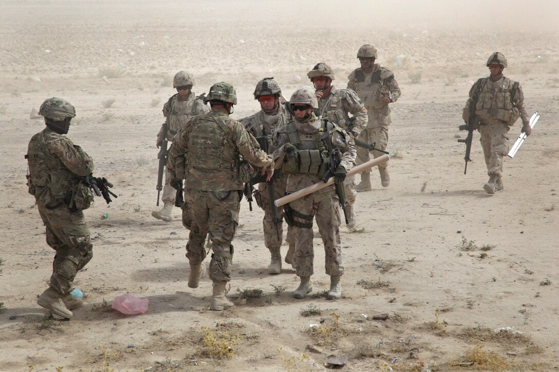 U.S. Army Lt. Col. Sean Bateman, left, links up with Canadian Army Col ...