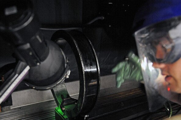Airman 1st Class Paul Nessle, 2nd Maintenance Squadron, operates the controls of the Magnetic Particle Bench while a part gets demagnetized in the 2nd Propulsion Flight building on Barksdale Air Force Base, La., July 8. The machine can magnetize and demagnetize metallic objects, and can be used to perform quality control checks on metallic parts. (U.S. Air Force photo/Airman 1st Class Micaiah Anthony)(RELEASED) 