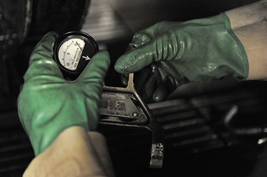 Airman 1st Class Paul Nessle, 2nd Maintenance Squadron, uses a field indicator to measure the electromagnetic field the part is omitting in the 2nd Propulsion Flight building on Barksdale Air Force Base, La., July 8. The machine can magnetize and demagnetize metallic objects, and can be used to perform quality control checks on metallic parts. (U.S. Air Force photo/Airman 1st Class Micaiah Anthony)(RELEASED) 