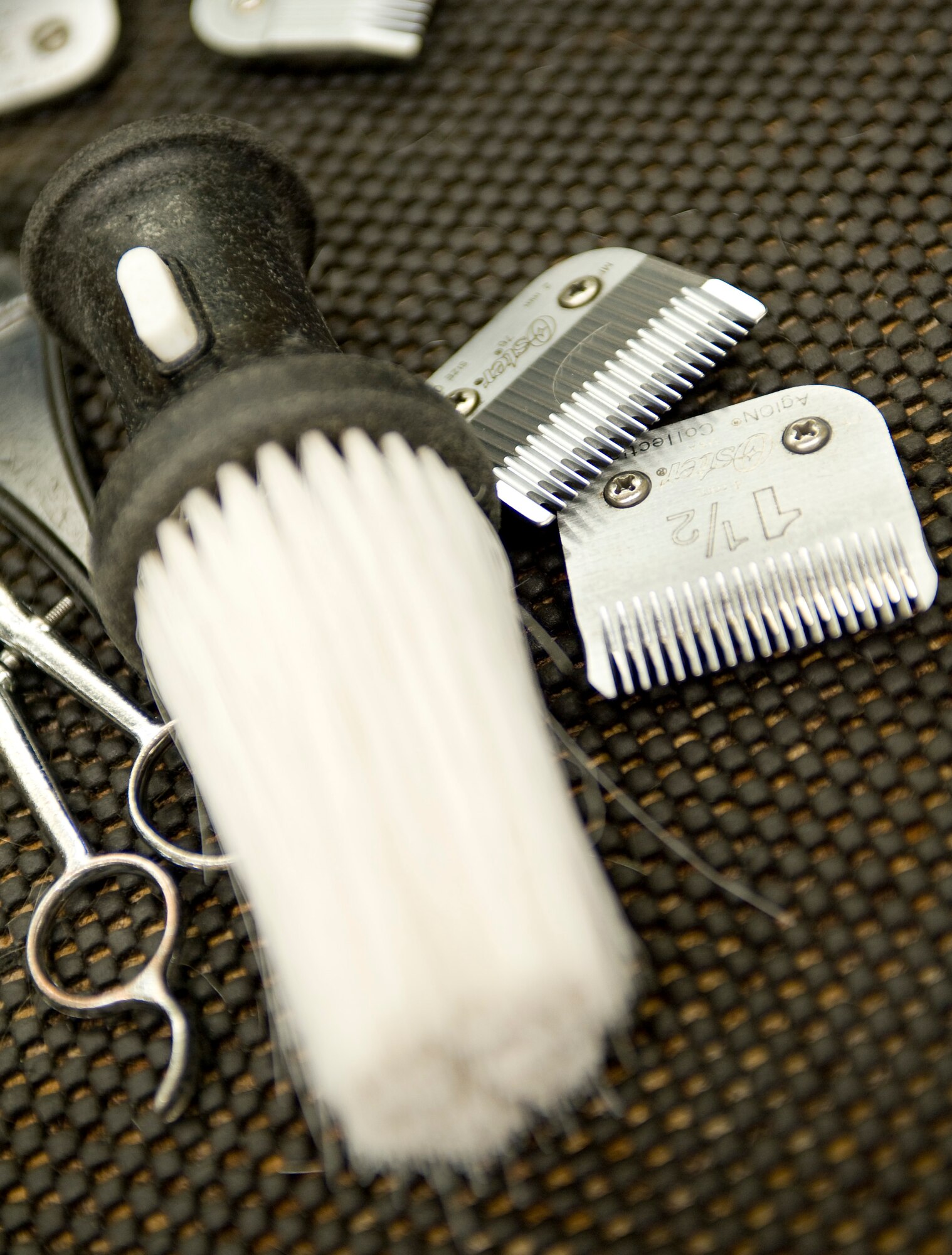 Hair cutting accessories sit on the counter at the main barbershop in the Base Exchange on Barksdale Air Force Base, La., July 7. The barbershop gives several hundred haircuts each week to service members and their families. (U.S. Air Force photo/Senior Airman Chad Warren)(RELEASED)