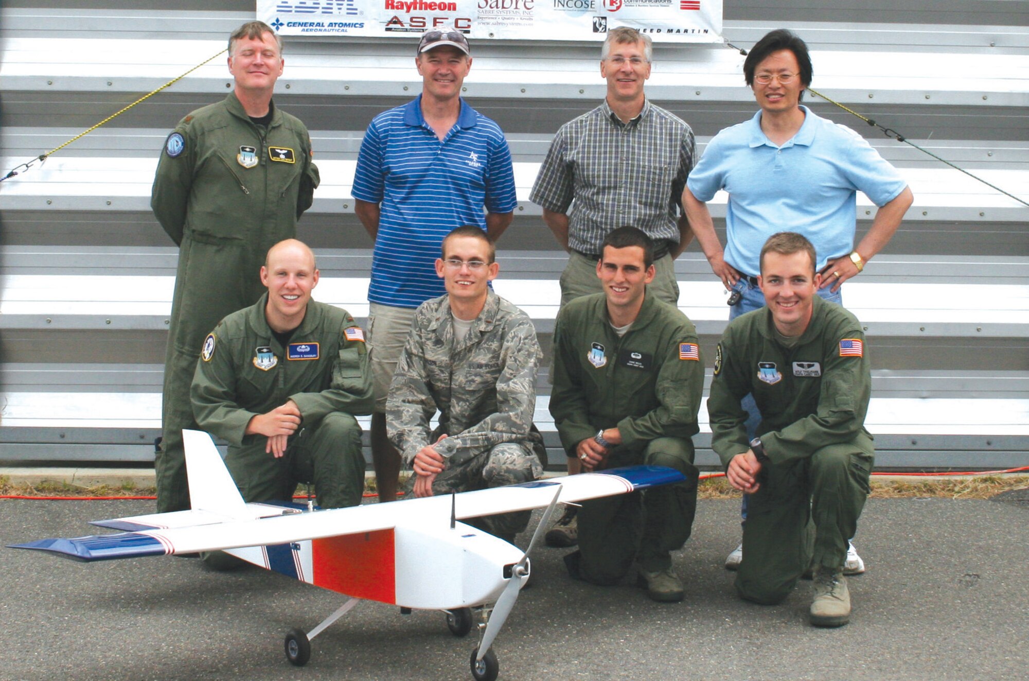 The Academy’s Unmanned Aerial Systems team and their faculty advisers with the remotely piloted aircraft they designed and built for the student UAS competition in Patuxent River, Md. (Courtesy Photo)