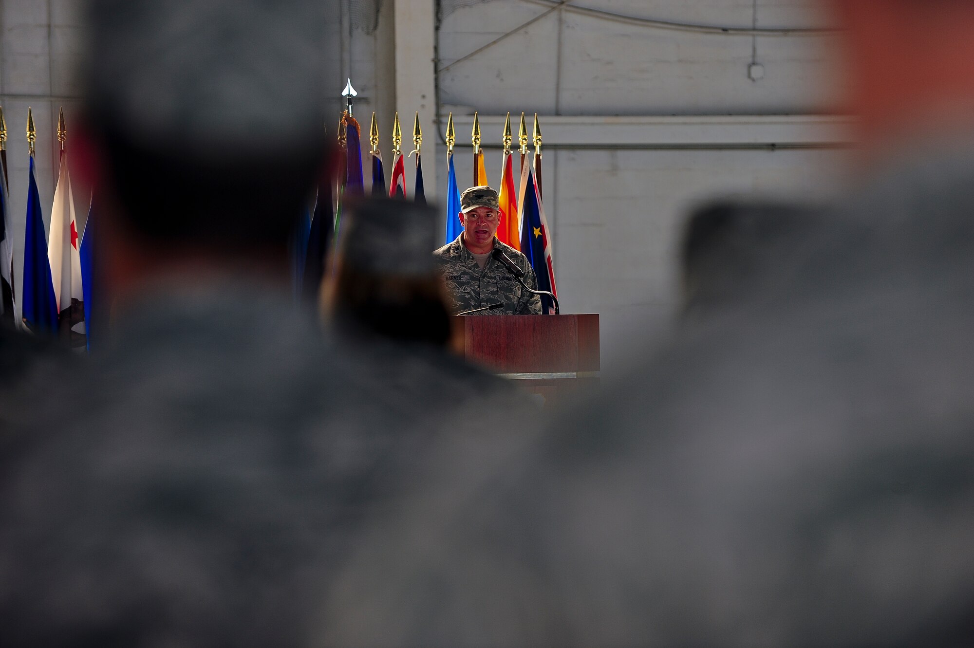 Col. Donald Barnes gives a final speech to his troopS before relinquishing his command to Col. James Hodges during the 6th Mission Support Group Change of Command ceremony at Hanger 3 on MacDill Air Force Base, Fla., July 6, 2011. (US Air Force photo by Airman 1st Class Melanie Bulow-Gonterman/Released)