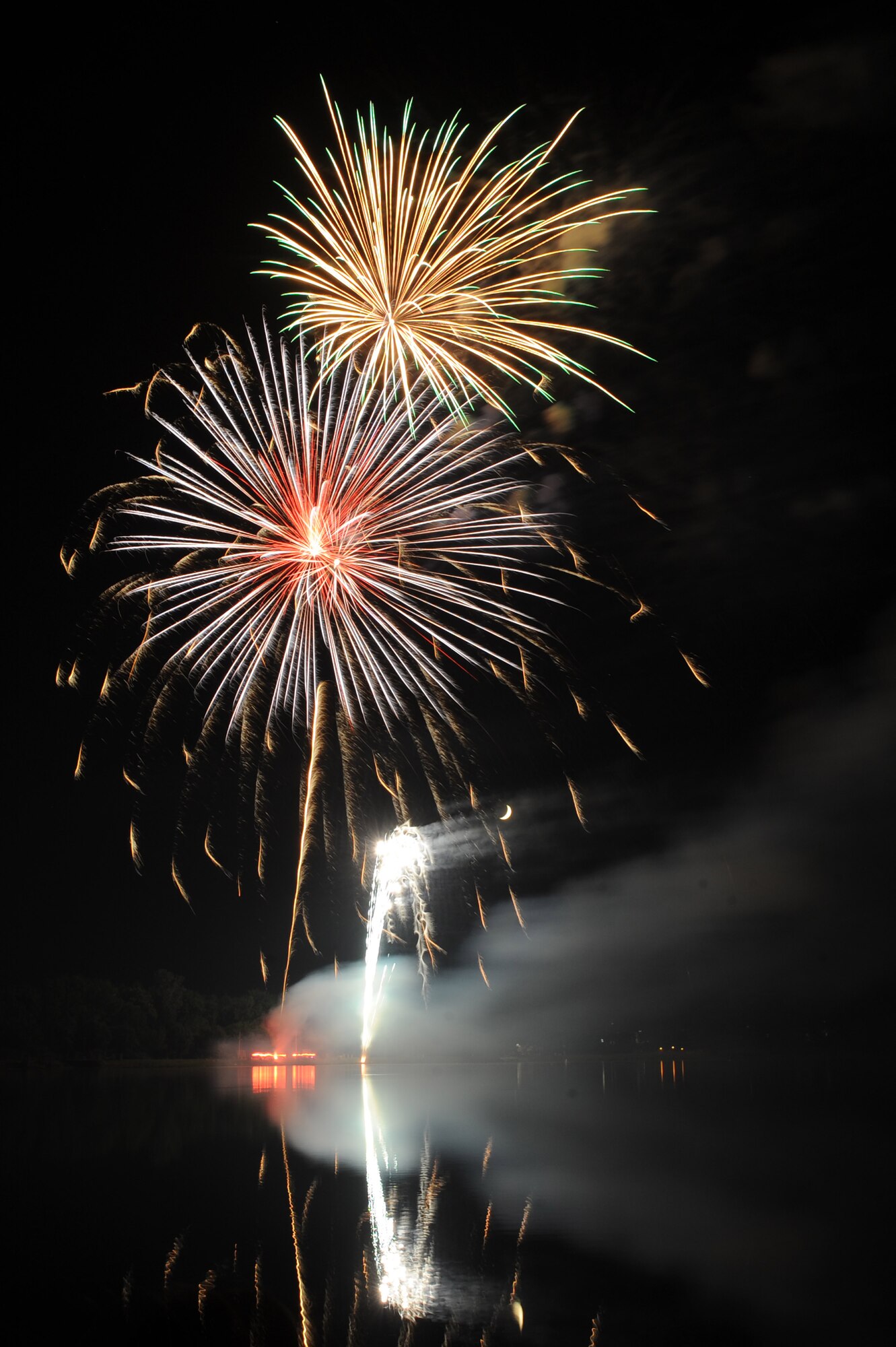 Fireworks light up the evening sky with a shower of vibrant colors during the Little Rock Air Force Base Fourth of July celebration at Little Rock Air Force Base, Ark.  The fireworks display capped off an afternoon of activities including the Air Mobility Command Icon contest, games and a family parade. (U.S. Air Force photo by Tech. Sgt. Chad Chisholm)
