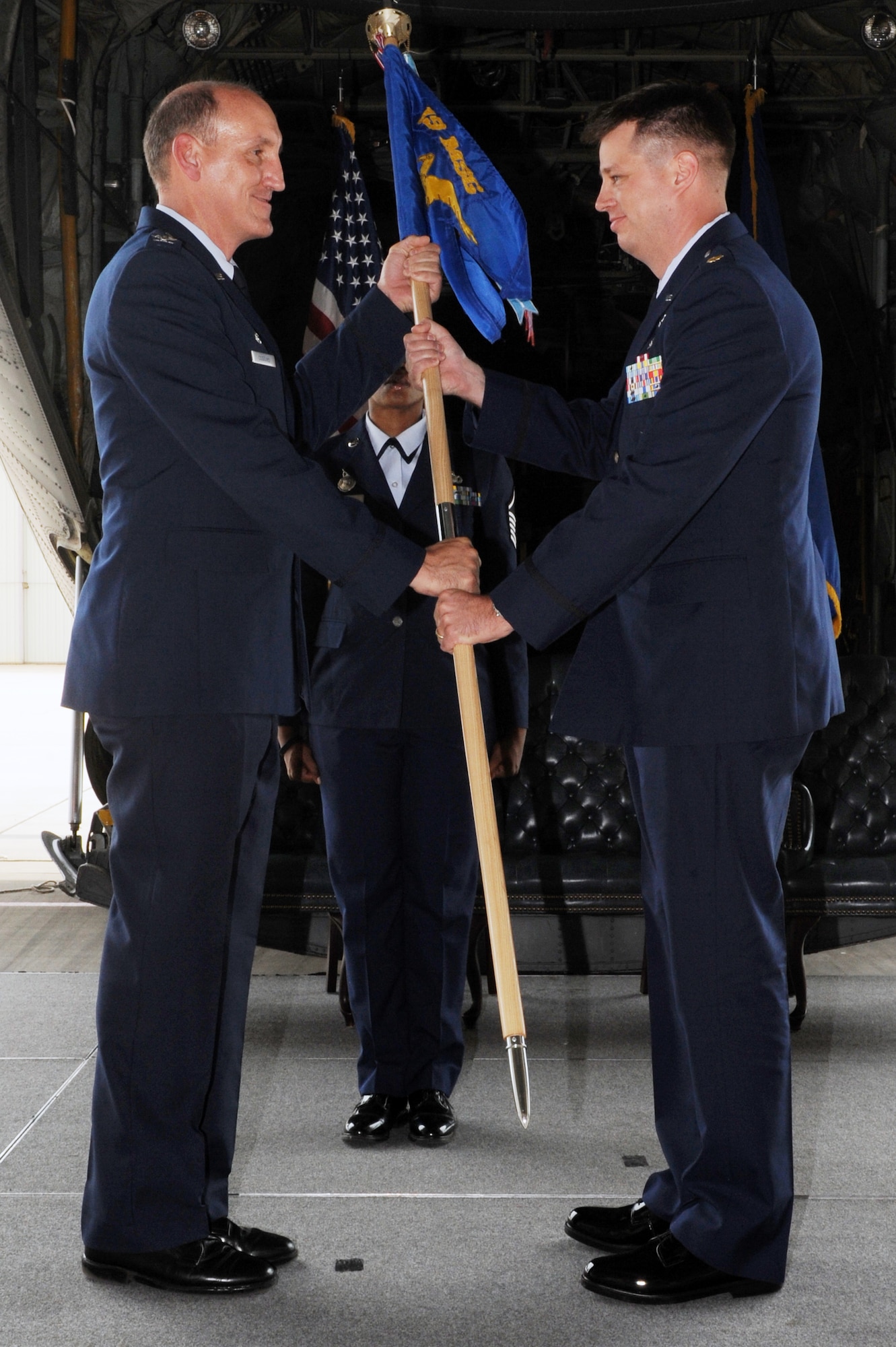 Maj. Peter Lex (right), 19th Security Forces Squadron commander, accepts the squadron guidon from Col. Andy Coggins, 19th Mission Support Group commander July 7, 2011, at Little Rock Air Force Base, Ark. The 19th SFS mission is to provide integrated defense for the protection of the world’s largest C-130 wing ensuring it meets its mission to “Deploy and Train the World’s Best C-130 Combat Airlifters.” (U.S. Air Force photo by Airman 1st Class Rusty Frank)

