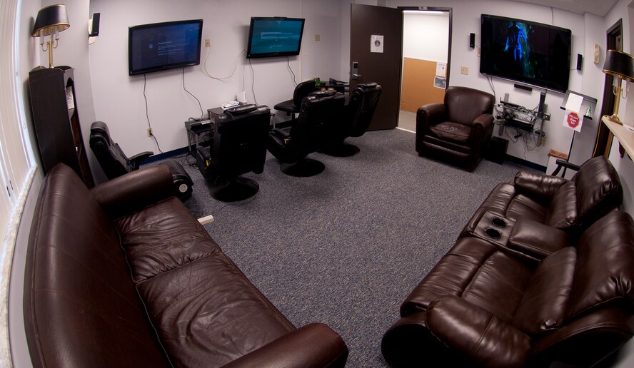 A living room with gaming consoles, gaming chairs, leather couches and a 60-inch high-definition TV sits in the newly relocated the Komodo Center in Bldg. 573 at Moody Air Force Base, Ga., July 6, 2011. Formerly in the 23rd Mission Support Group building, the center has been at its new location for a week. (U.S. Air Force photo by Airman 1st Class Joshua Green/Released)
