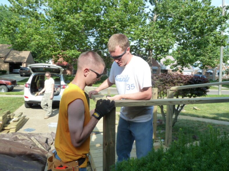 Capt. John Jaszkowiak and Capt. Josh Hollingsworth install handrails.
