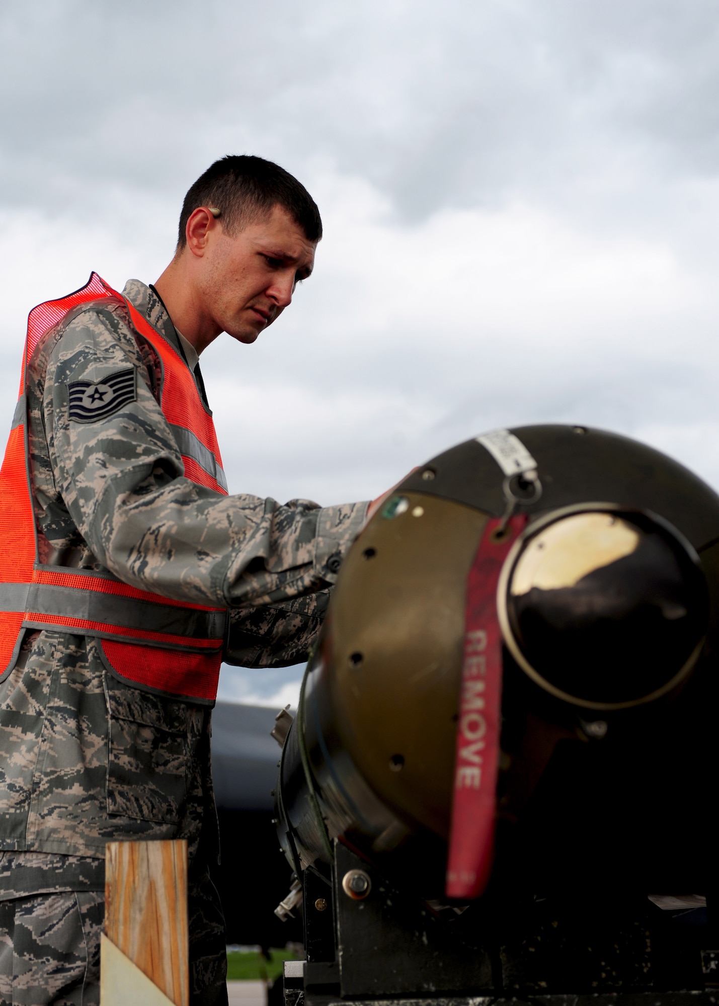 Tech. Sgt. Mathew Timm inspects munitions before being loaded onto the B-1B Lancer for the 28th Maintenance Group Quarterly Competition at Ellsworth Air Force Base, S.D. July 6, 2011. The load competition consists of two, four-person teams competing for speed and efficiency. (U.S. Air Force photo by/Airman Alystria Maurer/Released)