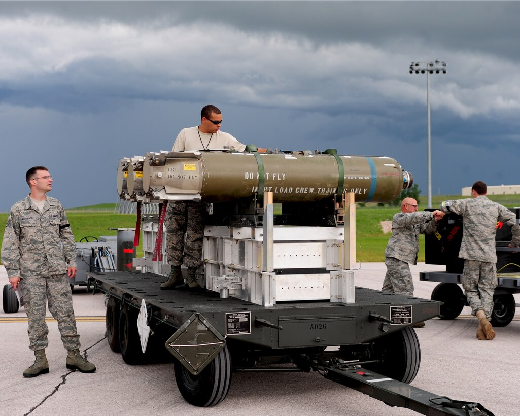 Members of the 34th Bomb Squadron prepare for the 28th Maintenance Group Quarterly Load Competition at Ellsworth Air Force Base, S.D.  July 6, 2011. The crews are rated on speed, efficiency, and safety as they load munitions onto a B-1B Lancer. (U.S. Air Force photo by/Airman Alystria Maurer/Released)