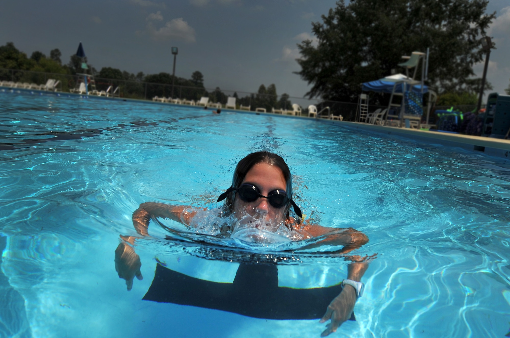 SHAW AIR FORCE BASE SC. -- Kaitlynn Solanes, life guard and water aerobics instructor, completes leads lap swimming during an afternoon water aerobics class here July 6, 2011. The 20th Force Support Squadron offers several different swimming classes at both the Lakeside and Woodland swimming pools. (U.S. Air Force photo by Senior Airman Kenny Holston)(Released)