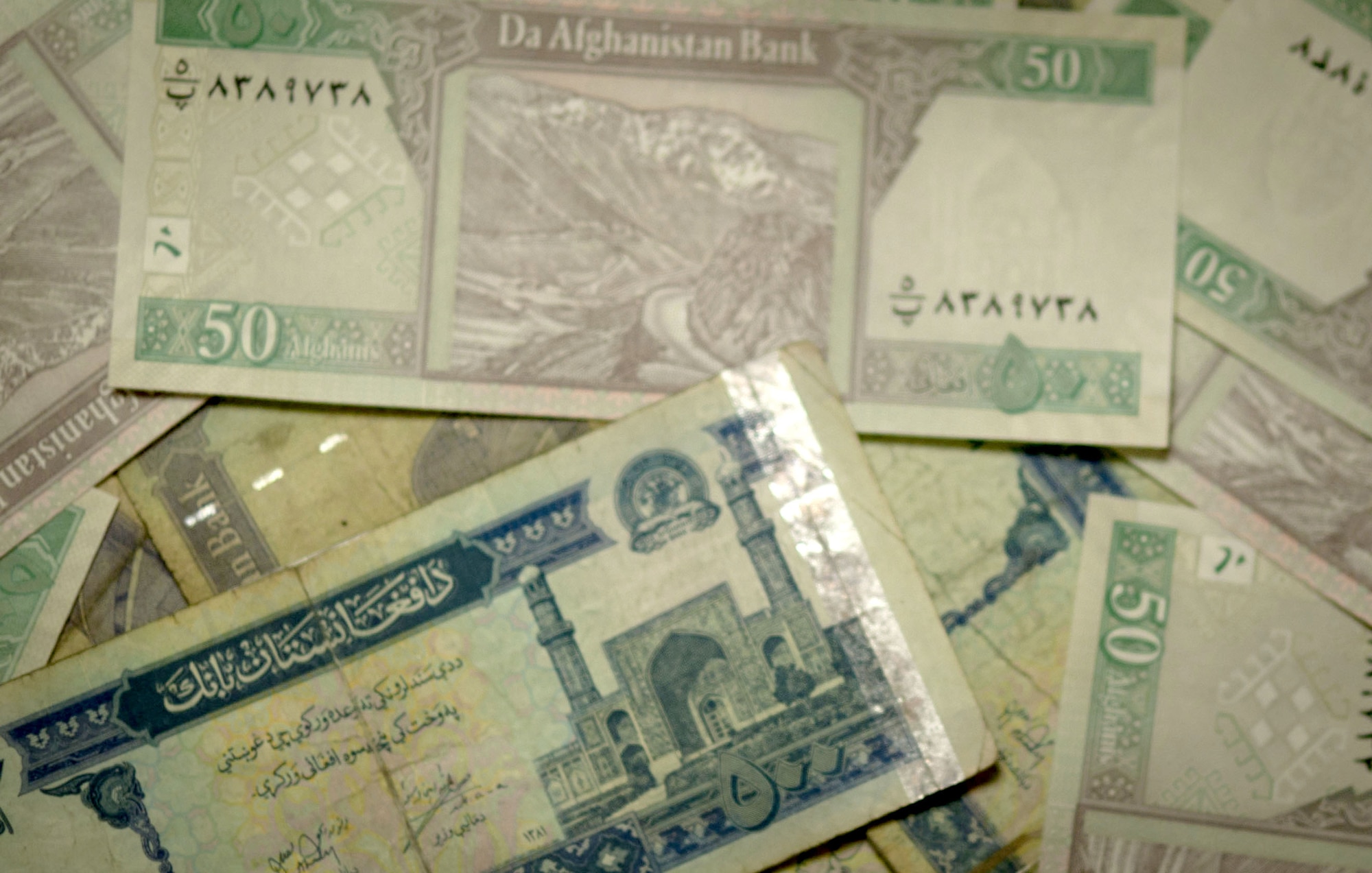 Decreasing United States taxes and rejuvenating the economy in Afghanistan are benefits that occur from utilizing Afghani at Kandahar Air Field, Afghanistan, July 8, 2011. It costs United States taxpayers $64,000 to print a million dollars in US currency. (U.S. Air Force photo by Senior Airman Corey Hook)