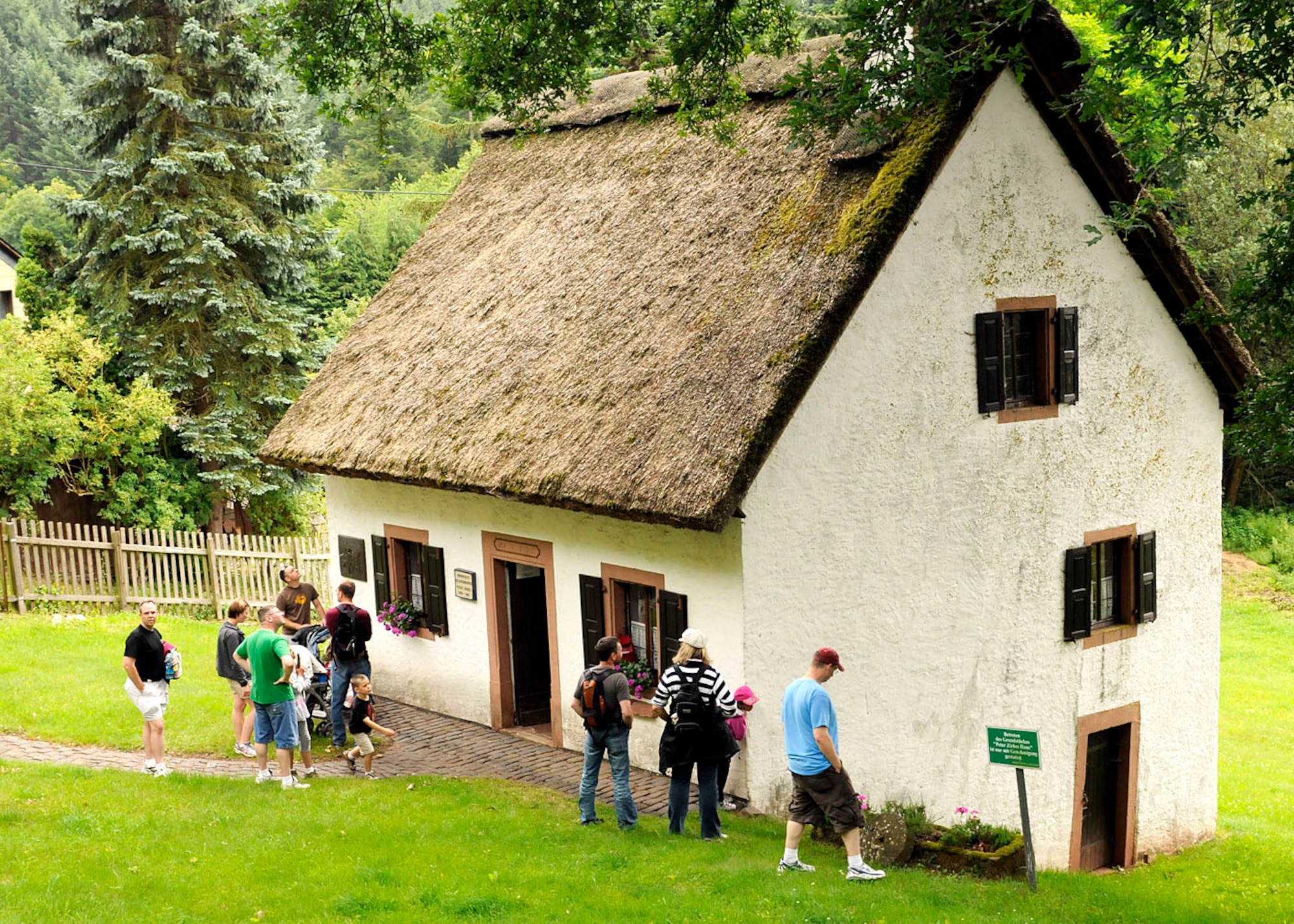 SPANGDAHLEM AIR BASE, Germany -- Base members look at the 200-year-old home of a local poet during an Explore the Eifel event near Landscheid-Niederkail July 2. Peter Zirbes lived from 1825 to 1901 and is regarded one of the first poets from the Eifel region. Explore the Eifel is an annual base occurrence to give Sabers a chance to tour the local area. (U.S. Air Force photo / Senior Airman Daryl Knee)