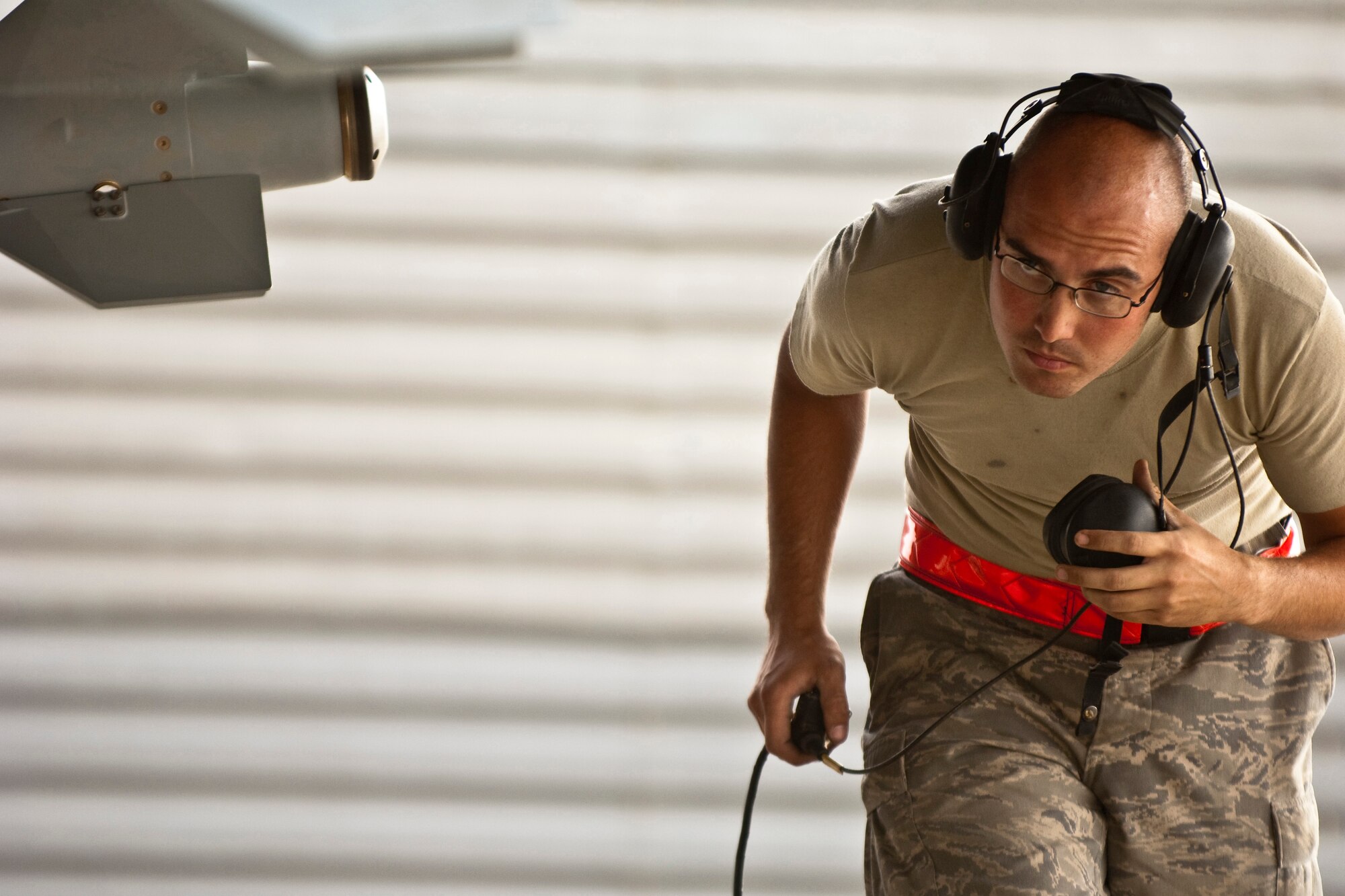 BAGRAM AIRFIELD, Afghanistan -- Senior Airman Russell H. Taylor, 455th Expeditionary Aircraft Maintenance Squadron crew chief, performs a pre-flight inspection on an F-15E Strike Eagle before takeoff June 26. Airman Taylor is currently deployed from Mountain Home Air Force Base, Idaho. (U.S. Air Force photo by Staff Sgt. Jorge Intriago)