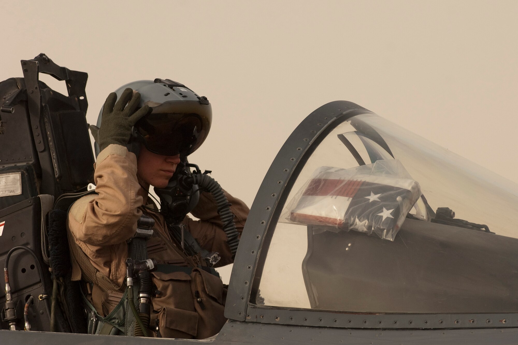 BAGRAM AIRFIELD, Afghanistan -- Maj. Tracy Schmidt, 389th Expeditionary Fighter Squadron pilot, conducts pre-flight checks in an F-15E Strike Eagle here before takeoff June 26. Major Schmidt is deployed from Mountain Home Air Force Base, Idaho. (U.S. Air Force photo by Staff Sgt. Jorge Intriago)