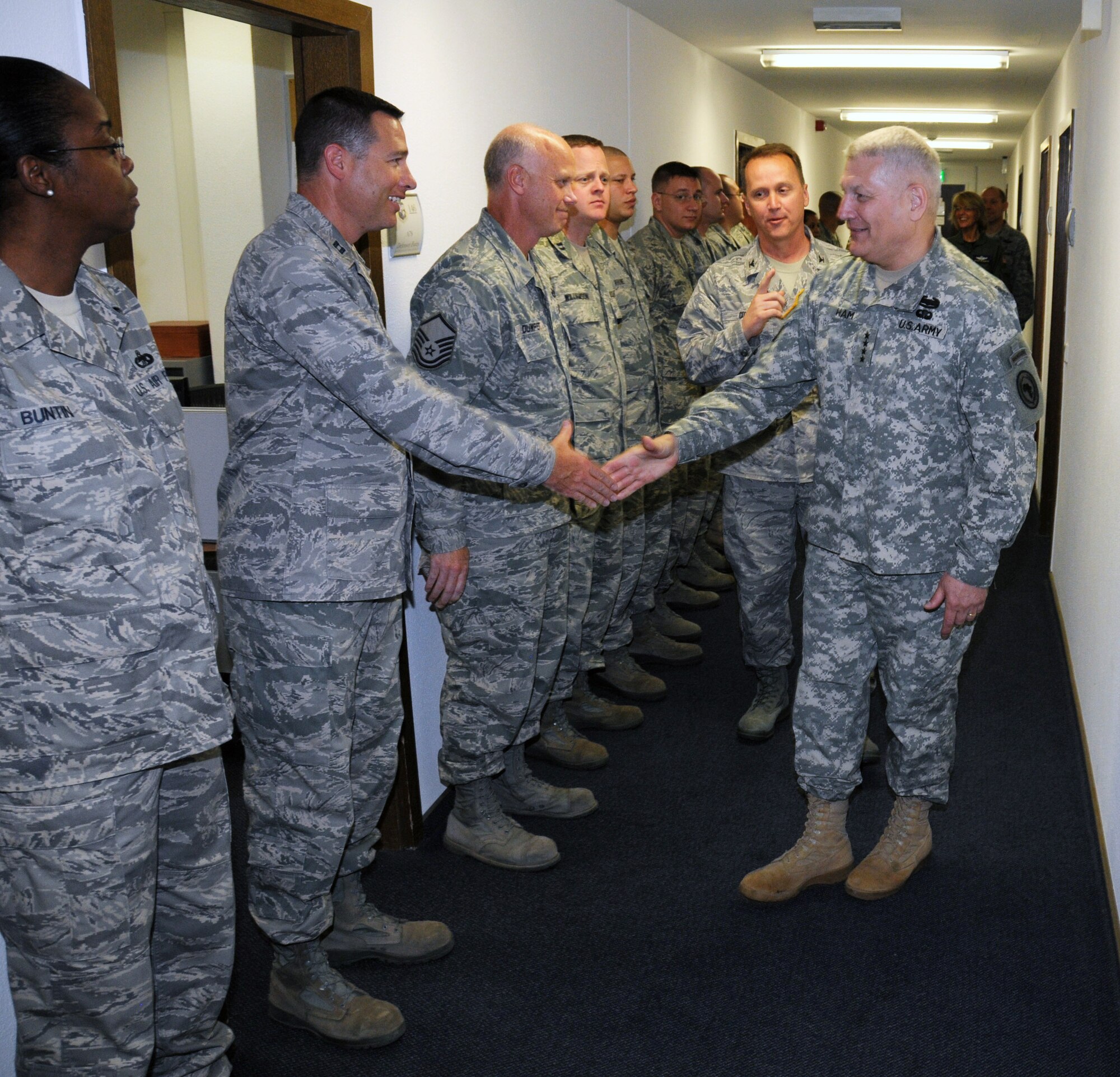 RAMSTEIN AIR BASE, Germany -- U.S. Africa Command Commander Gen. Carter Ham shakes hands with Airmen from 17th Air Force (Air Forces Africa) during a
visit here July 5, 2011. Gen. Ham thanked the Airmen for their continued
work with Africa and presented medals for their contributions during
Operation Odyssey Dawn. (U.S. Air Force photo by Master Sgt. Jim Fisher)
