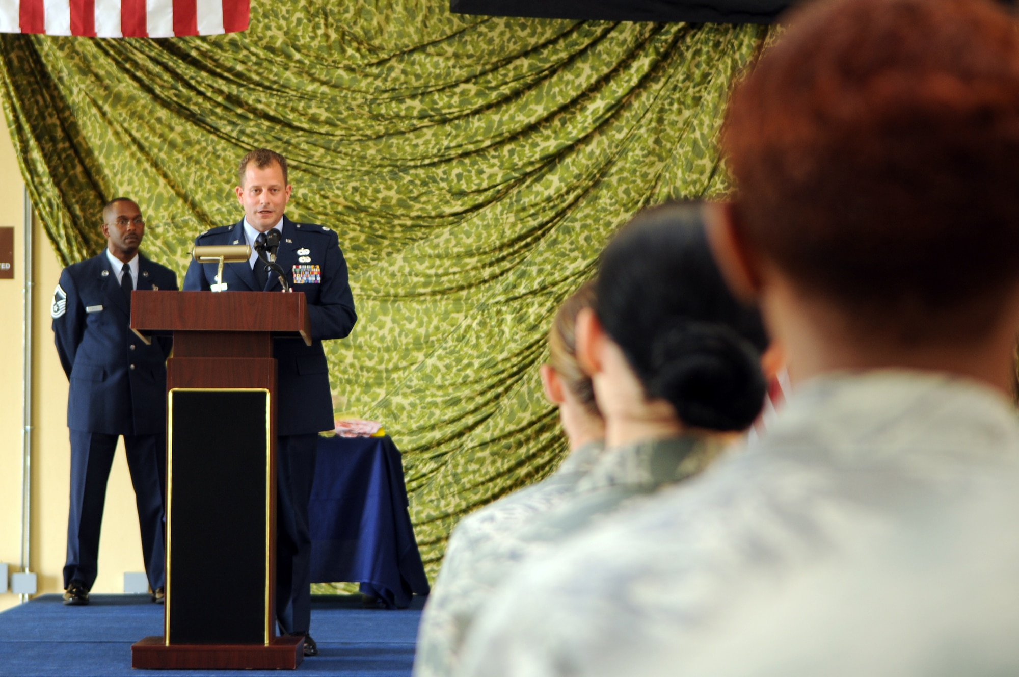 Lt. Col. Scott Belanger addresses the audience for one last time as the 724th Air Mobility Squadron commander during the 724th AMS change of command ceremony July 6 at Aviano Air Base, Italy. Maj. Ryan Norman assumed command of the 724th AMS. Belanger was selected to command a unit at a deployed location. (U.S. Air Force photo/Staff Sgt. Julius Delos Reyes)