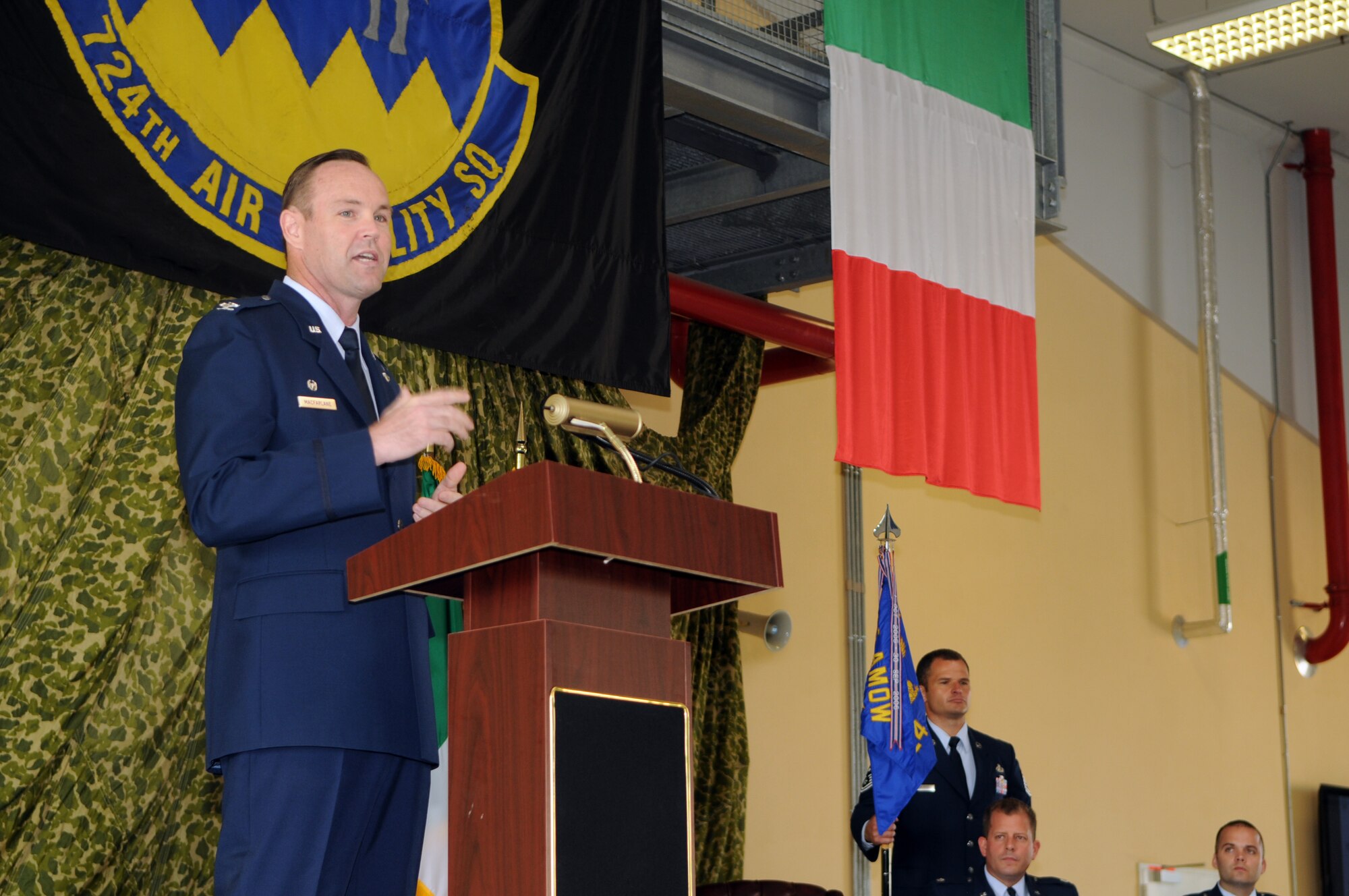 Col. James MacFarlane, 721st Air Mobility Operations Group commander from Ramstein Air Base, Germany, addresses the audience during the 724th Air Mobility Squadron change of command ceremony July 6 at Aviano Air Base, Italy. Maj. Ryan Norman assumed command of the 724th AMS from Lt. Col. Scott Belanger. (U.S. Air Force photo/Staff Sgt. Julius Delos Reyes)