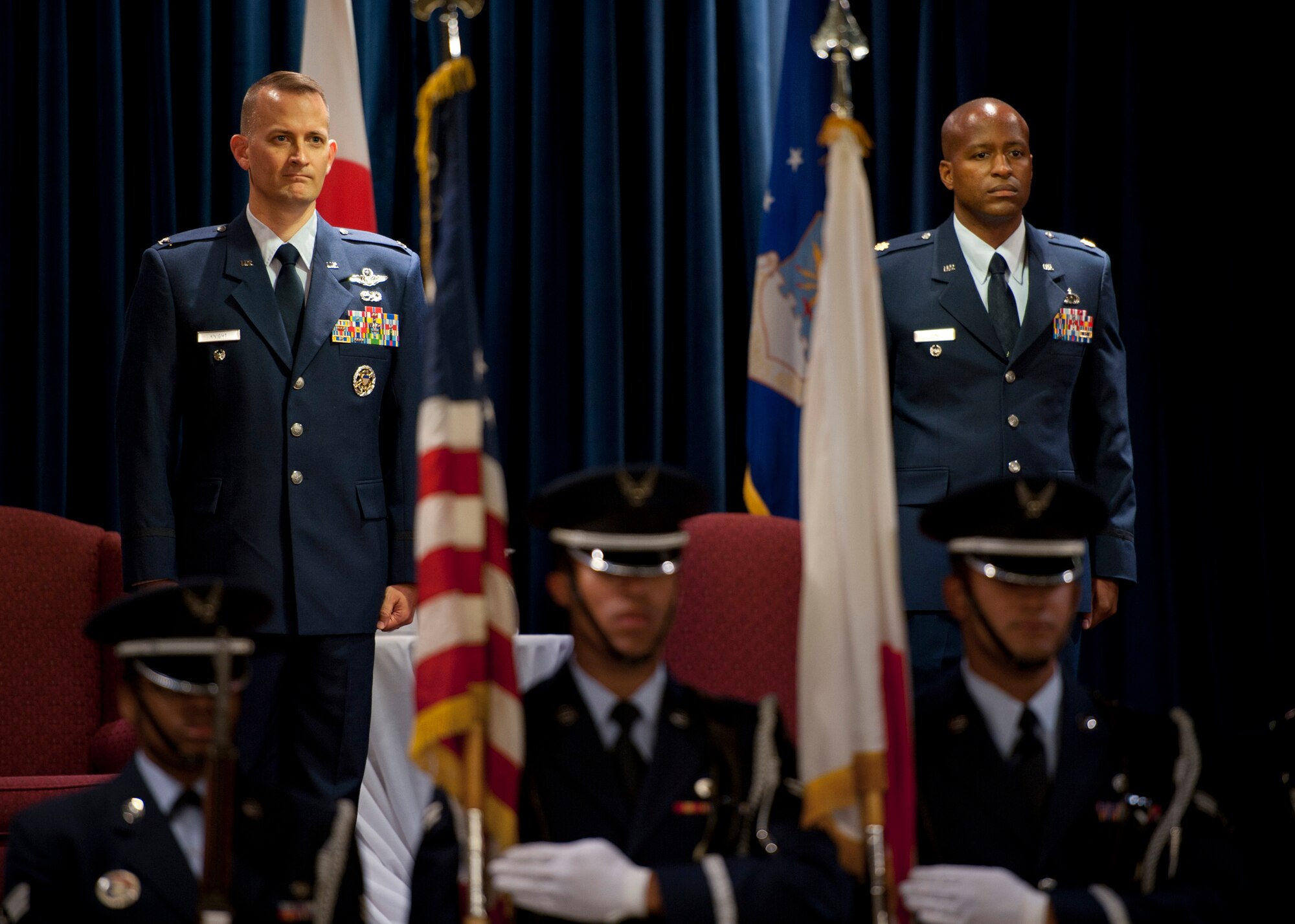 YOKOTA AIR BASE, Japan -- Col. Bill Knight (left), 374th Airlift Wing vice commander, and Maj. Ned June stand at attention for the American and Japanese national anthems during the 374th Comptroller Squadron assumption of command ceremony at Yokota Air Base, Japan, July 6, 2011. (U.S. Air Force photo/Staff Sgt. Samuel Morse)