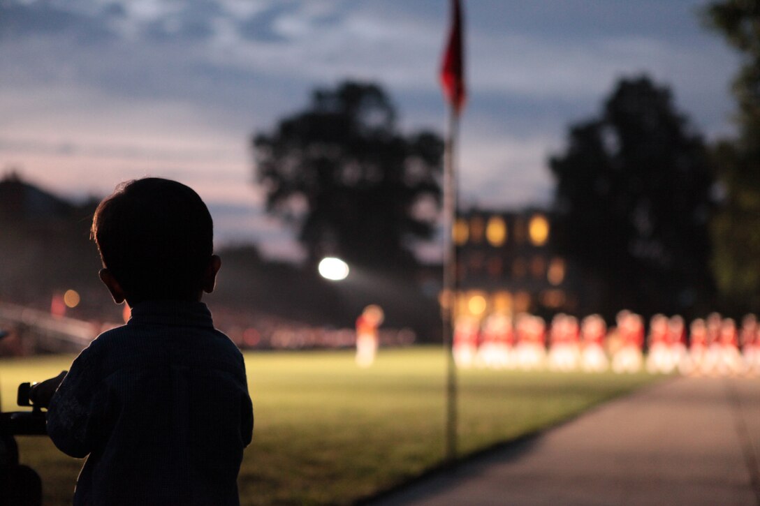 Reinaldo Fernandez, 21 months old, watches the U.S. Marine Band perform a musical set during a Friday Evening Parade at Marine Barracks Washington July 8, 2011.
