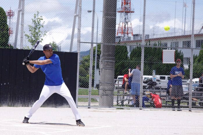 Paul Torres, ATC outfielder, prepares to swing at a pitch during ATC’s 16-6 win over the IYAOYAS at the main softball field here Saturday. ATC took the lead early in the game, scoring 14 runs in the first inning. The IYAOYAS scored only one run in the first inning before making five more runs in the third.