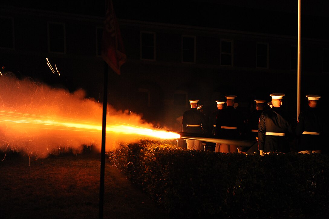 The Marine Corps Body Bearers fire a ceremonial 40 mm cannon during the finale of "Ode to Joy," performed by the Marine Drum and Bugle Corps, during a Friday Evening Parade at Marine Barracks Washington July 8, 2011.