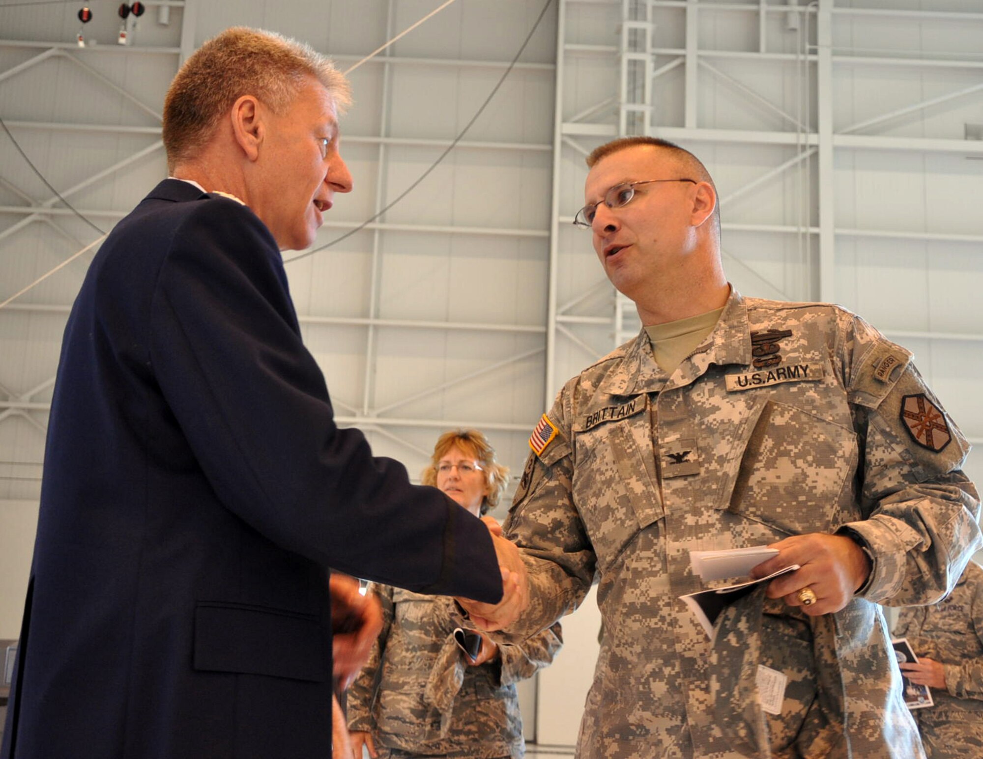 U. S. Air Force Col. Bruce Bowers, 446th Airlift Wing commander and U.S. Army Col. Thomas Britttain, commander Joint Base Lewis-McChord, meet at McChord Field here, July 9.  Colonel Bowers assumed command of the 446th AW in a ceremony presided by Fourth Air Force Commander Brig. Gen. Mark Kyle.  (U. S. Air Force photo by Tech. Sgt. Elizabeth Moody)