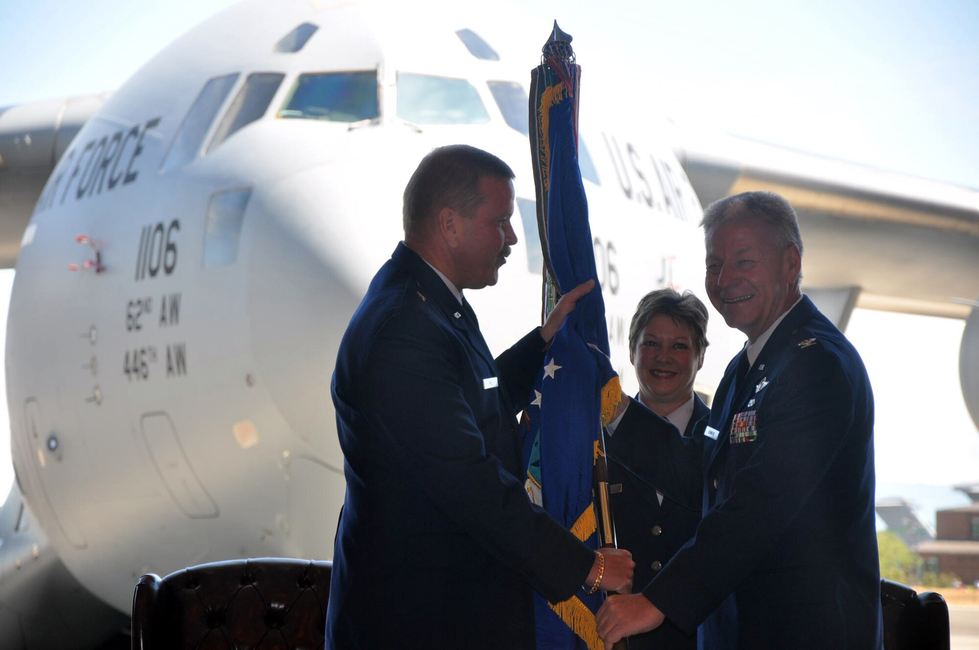 Col. Bruce Bowers assumes command of the 446th Airlift Wing here, in a ceremony presided by Fourth Air Force Commander Brig. Gen. Mark Kyle and 446th AW Command Chief Master Sgt. Gloria Bennett.  The passing of the colors symbolized Colonel Bowers' official assumption of command July 9, attended by Reservists, active duty members of the U.S. Air Force, U. S. Army and local civic leaders.  (From left to right, General Kyle, Chief Bennett, and Colonel Bowers.  U.S. Air Force photo by Tech. Sgt. Elizabeth Moody)