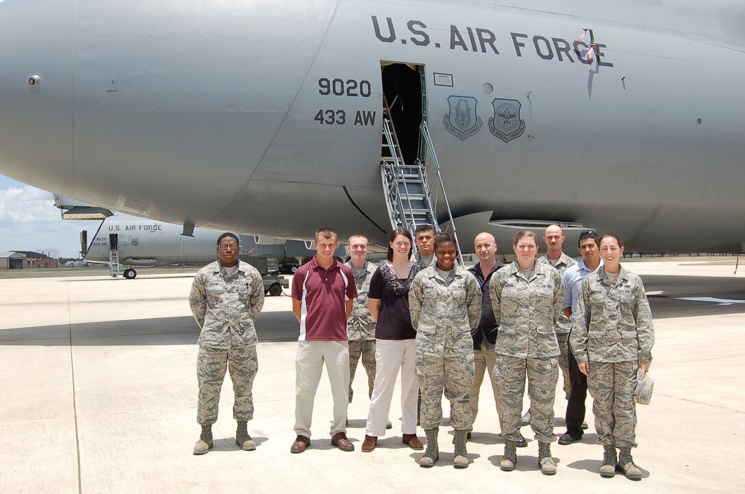 The newest Airmen to join the 433rd Airlift Wing pose for a group photo after touring the interior of a C-5 Galaxy cargo jet on Sunday July 10, 2011 at Lackland Air Force Base, Texas. (U.S. Air Force photo/Tech Sgt. Carlos J. Trevino)