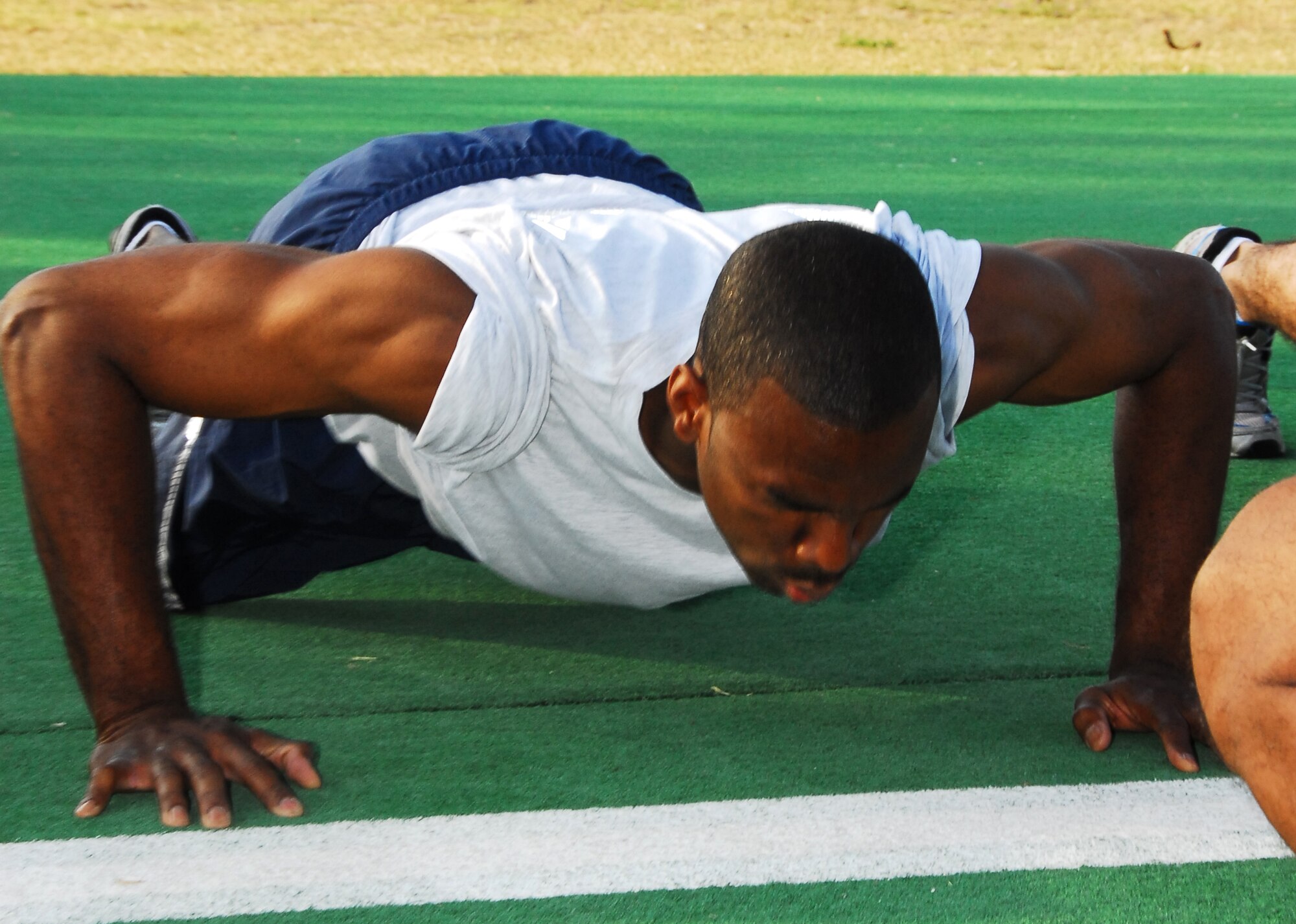 Master Sgt. Ronald Martin, 403rd Avionics, pushes to beat the time and exceed standards on the push-up portion of the physical fitness test held during July's UTA. The requirements for the PFT changed last year and Citizen Airmen of the 403rd Wing are excepting the challange to be Fit-to-Fight. (U.S. Air Force Photo/Staff Sgt. Tabitha Dupas