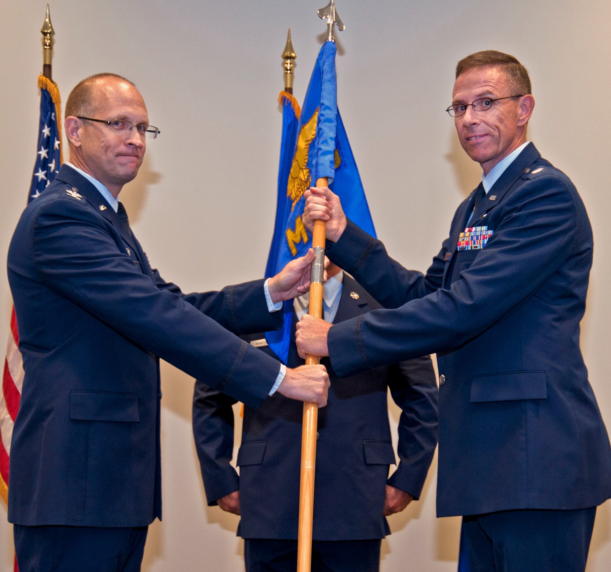 Col. Jay Jensen, 403rd Wing commander, appoints Lt. Col. Kevin Riley
as the new Mission Support Group commander in an Assumption of Command
ceremony held at the Roberts Maintenance Facility here during the July Unit
Training Assembly.  Though this is the first group Riley has commanded, he
brings a wealth of mission support knowledge having served more than six
years as the 315th MSG deputy commander, Charleston Air Force Base, S.C.  
