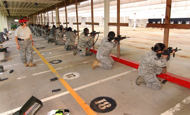 94th Security Forces Airmen shoot to qualify on the M-4 Carbine at Dobbins Air Reserve Base during the monthly Unit Training Assembly, July 9.  94th Security Forces Combat Arms Training and Maintenance instructors conduct the training with several hours of classroom and firing range instruction ending with a qualification course of fire.  (U.S. Air Force photo/ Brad Fallin)