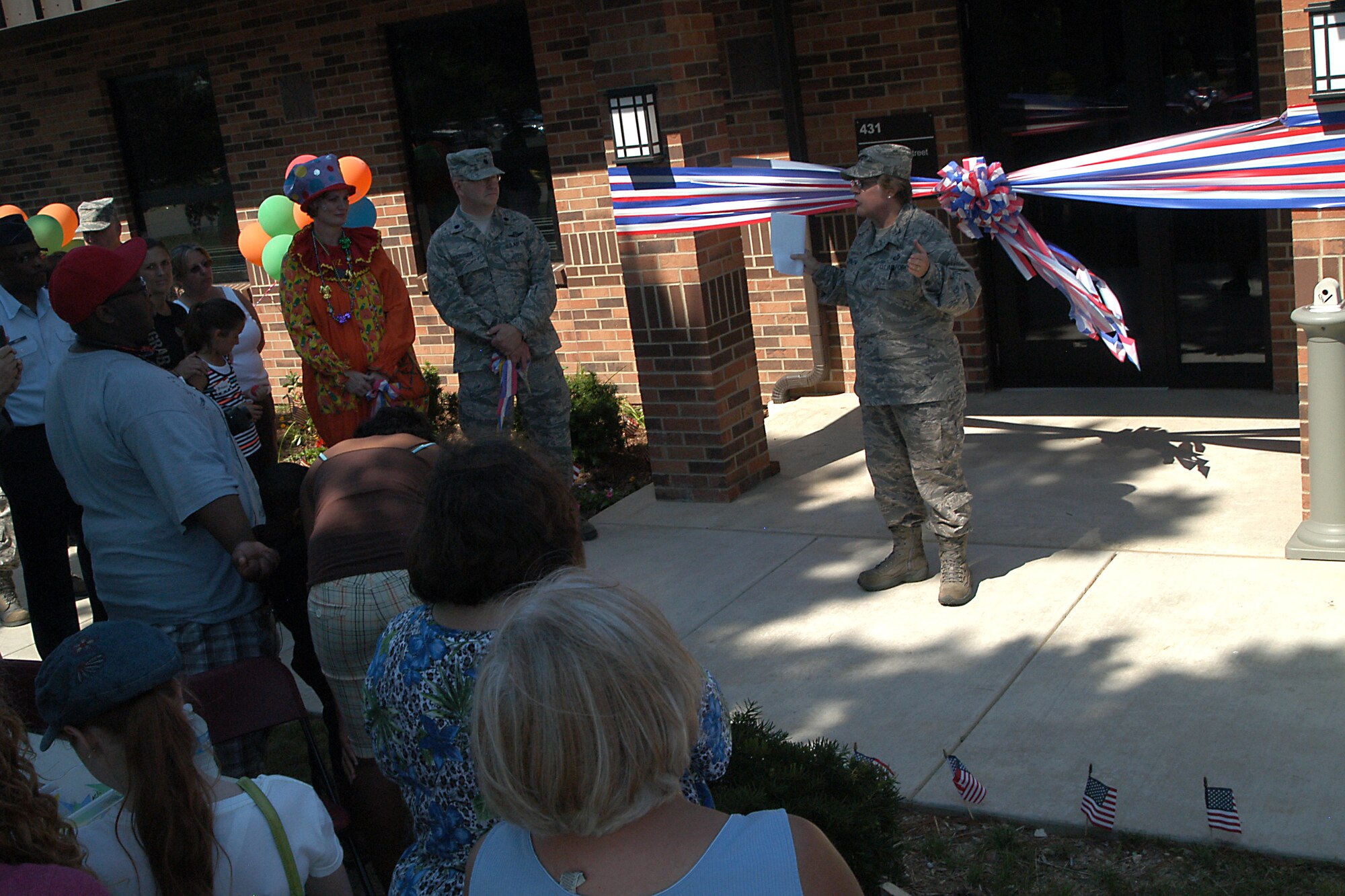 GRISSOM AIR RESERVE BASE, Ind. -- Col. Betty Bowen, 434th Mission Support Group commander, gives a speech about the importance of having support available for Airmen and their family members during a ribbon cutting ceremony for the new Grissom Airman and Family Readiness Center on base during the July unit training assembly.  The new building provides more space for Airmen and their family members. It also houses the 434th Seasoning Training Flight, the sexual assault response coordinator, newcomers flight, the 434th ARW chaplain?s office and maintenance supply liaison office. (U.S. Air Force photo/Senior Airman Damon Kasberg)                                