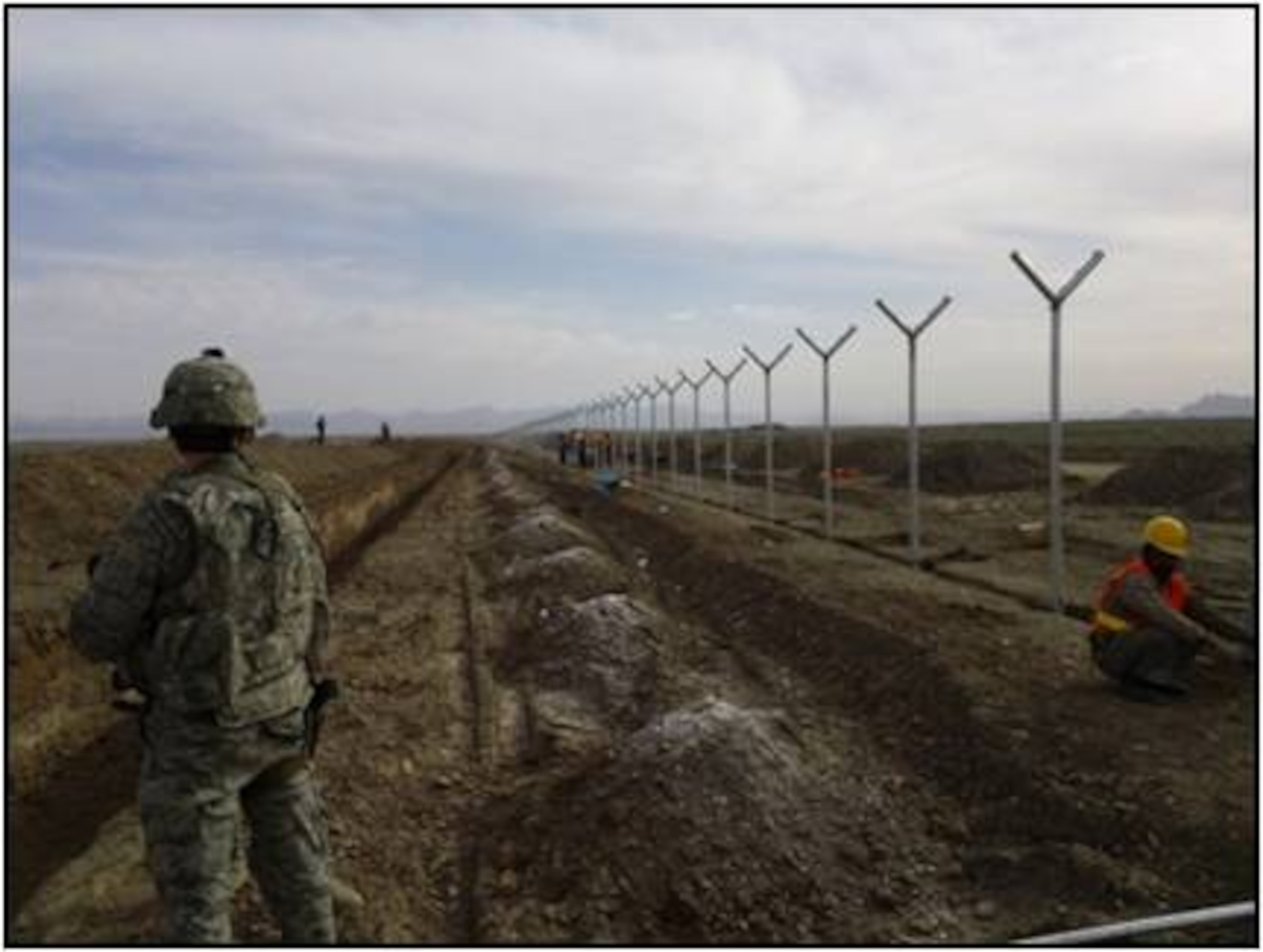 Members of the 838th Air Expeditionary Advisory Group in Shindand, construct eight miles of perimeter fence in an effort to expand the base recently.  The expansion tripled the base’s size and is part of a $500 million dollar project that makes the base second in size only to Bastion Field in Lashkar Gah.  The new expansion is slated to become the new living and work area for more than 3,000 coalition forces and government contractors.  The relocation of these members will make room for a new a 1.3-mile NATO training runway, with construction scheduled to begin early 2012.  (Air Force courtesy photo)