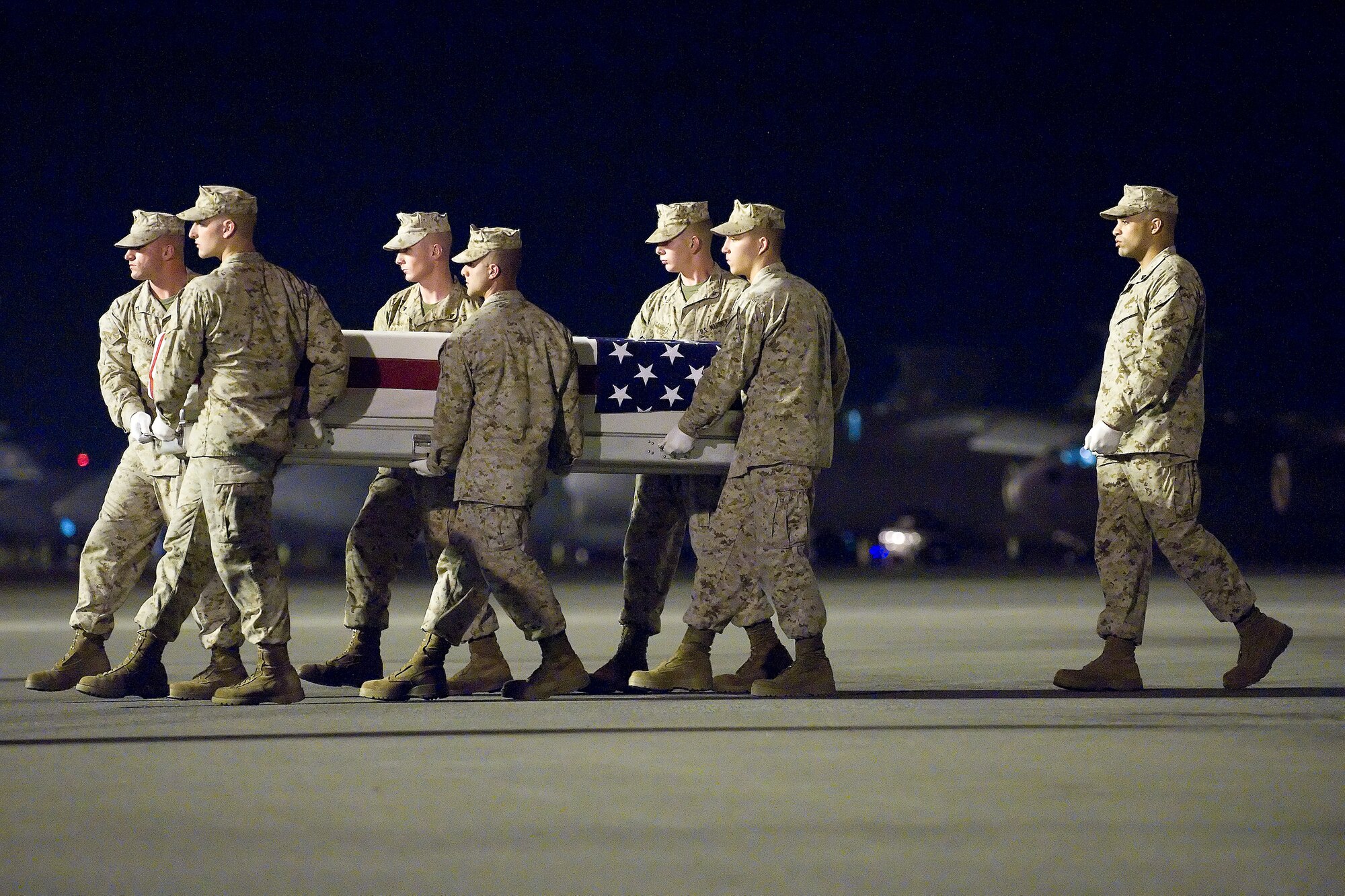 A U.S. Marine Corps carry team transfers the remains of Marine Staff Sgt. Thomas J. Dodds Dudley of Tega Cay, S.C., at Dover Air Force Base, Del., July 9, 2011. Dodds Dudley was assigned to Marine Air Group 26, 2nd Marine Air Wing, II Marine Expeditionary Force, Marine Corps Air Station New River, Jacksonville, N.C. (U.S. Air Force photo/Adrian Rowan)