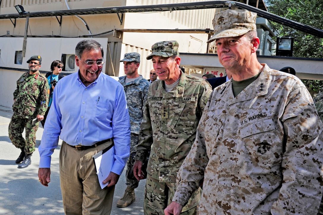 U.S. Defense Secretary Leon E. Panetta walks with U.S. Army Gen. David H. Petraeus, current commander of U.S. and international forces in Afghanistan, and U.S. Marine Corps Lt. Gen. John R. Allen, the forces' future commander, at Camp Eggers in Kabul, Afghanistan, July 10, 2011.