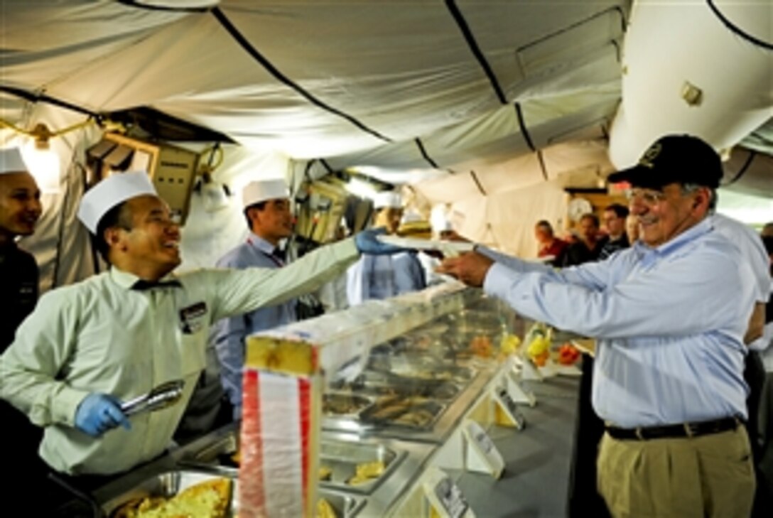 U.S. Defense Secretary Leon E. Panetta visits the dining facility at Camp Dwyer, Afghanistan, July 10, 2011.