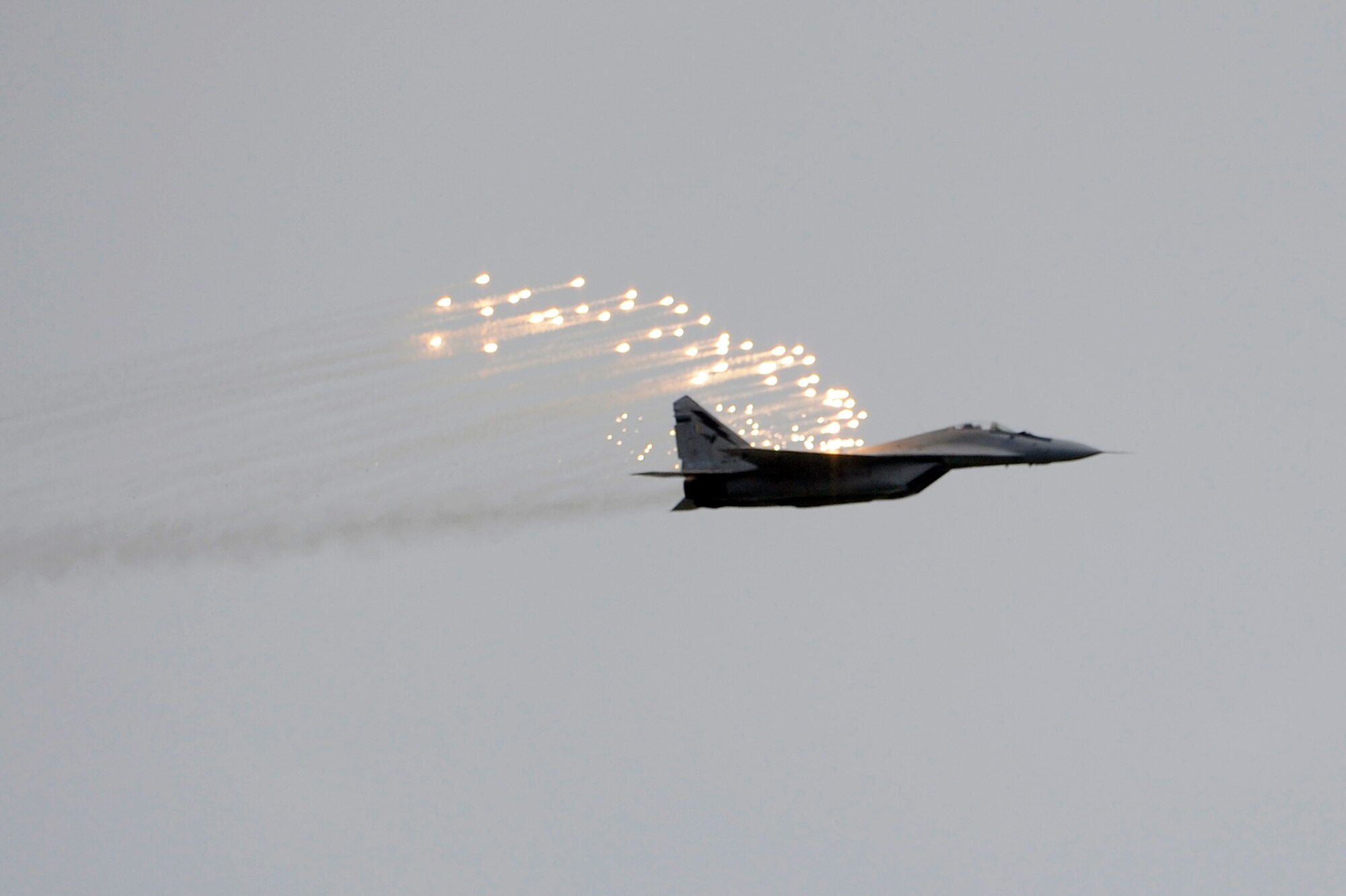 Brunei Darussalam -- A MiG 29 from the Royal Malaysian Air Force releases flares while performing during the 3rd Biennial Brunei Darussalam International Defense Exhibition in Brunei Darussalam July 6. BRIDEX 2011, themed "Mapping Future Security and Technological Challenges," was organized by the Ministry of Defense together with the Sultan Haji Hassanal Bolkiah Institute of Defense and Strategic Studies. Two F-16 Fighting Falcons and 15 members from the 35th Fighter Wing from Misawa Air Base, Japan, represented the U.S. Air Force and Pacific Air Forces during the four-day event for the first time. (U.S. Air Force photo/Staff Sgt. Marie Brown/Released)