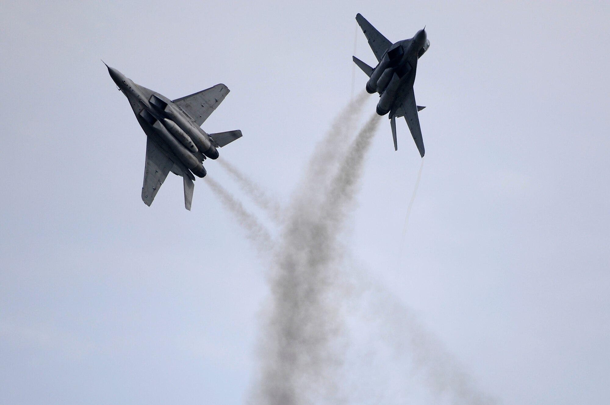 Brunei Darussalam -- Two MiG 29's from the Royal Malaysian Air Force perform maneuvers during the 3rd Biennial Brunei Darussalam International Defense Exhibition in Brunei Darussalam July 6. BRIDEX provides a platform for leading manufacturers, suppliers and decision makers to deliberate on military solutions and showcase innovative technologies. Two F-16 Fighting Falcons and 15 members from the 35th Fighter Wing from Misawa Air Base, Japan, represented the U.S. Air Force and Pacific Air Forces during the four-day event for the first time. (U.S. Air Force photo/Staff Sgt. Marie Brown/Released)