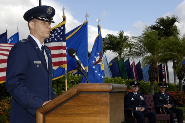 Col. David Baldessari, 15th Operations Group commander, addresses his new command during a change of command ceremony here, July 8. Colonel Jeffrey Morgan, outgoing 15 OG commander is making a permanent change of station to the Pentagon and relinquished command to Colonel Baldessari. Colonel Baldessari, a U.S. Air Force Academy graduate, entered the Air Force in 1989. He is a command pilot with more than 3,700 flight hours. He previously served as the United States Transportation Command Liaison Officer to North American Aero Space Defense. (U.S. Air Force photo/Dave Underwood) 
