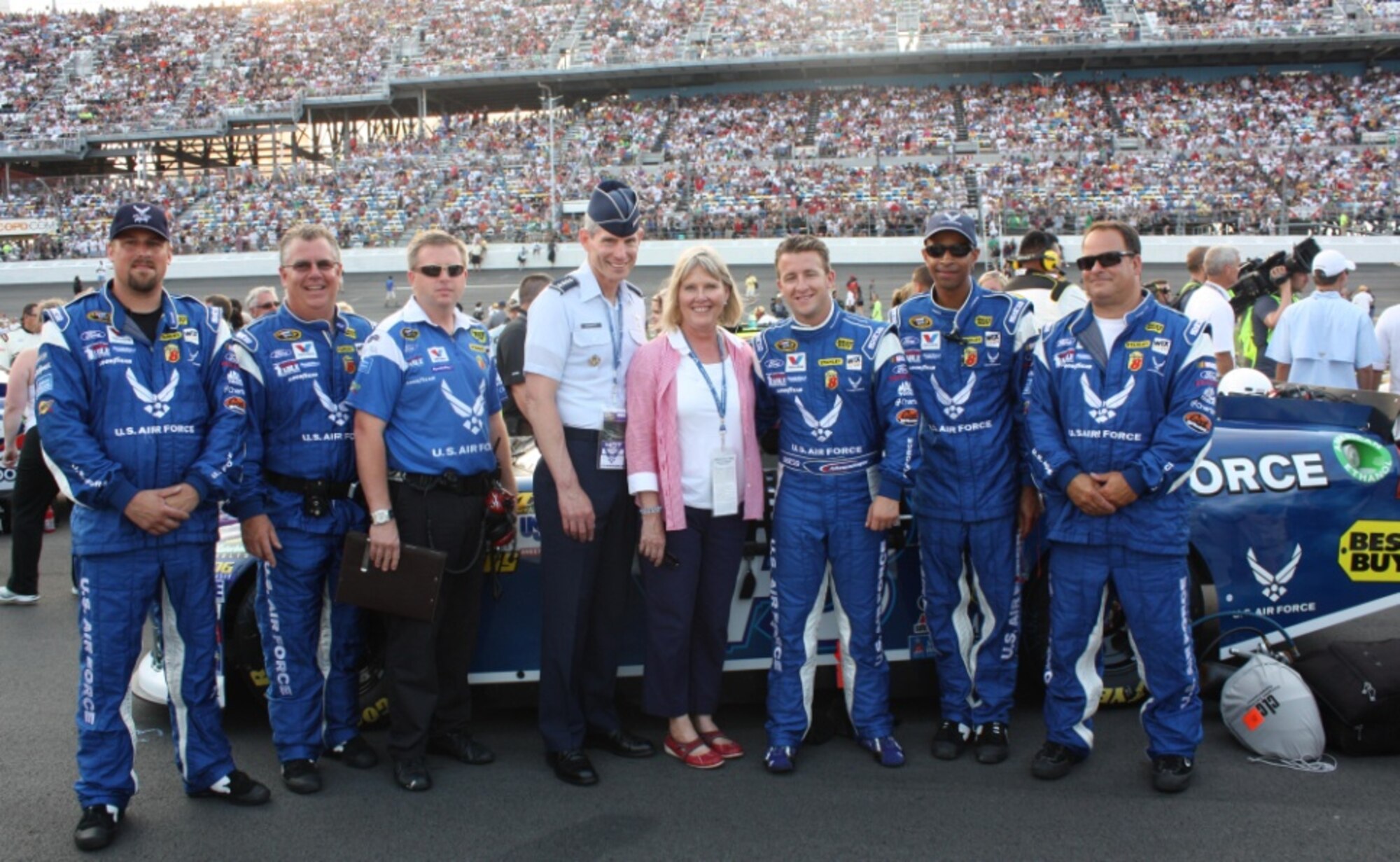 A.J. Allmendinger, NASCAR driver for the Air Force-sponsored #43 car (third from right), and his crew pose for a photo with Air Force Chief of Staff Gen. Norton Schwartz and his wife Suzie. Allmendinger finished in the top ten July 2, 2011, at the Coke Zero 400 in Daytona Beach, Fla. (U.S. Air Force photo/Capt. Maggie M. Silva)