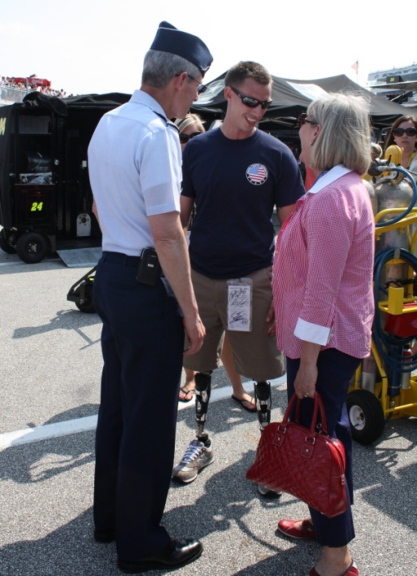 Air Force Chief of Staff Gen. Norton Schwartz and his wife Suzie speak with a Wounded Warrior who was honored July 2, 2011, at the Coke Zero 400 in Daytona Beach, Fla. (U.S. Air Force photo/Capt. Maggie M. Silva)