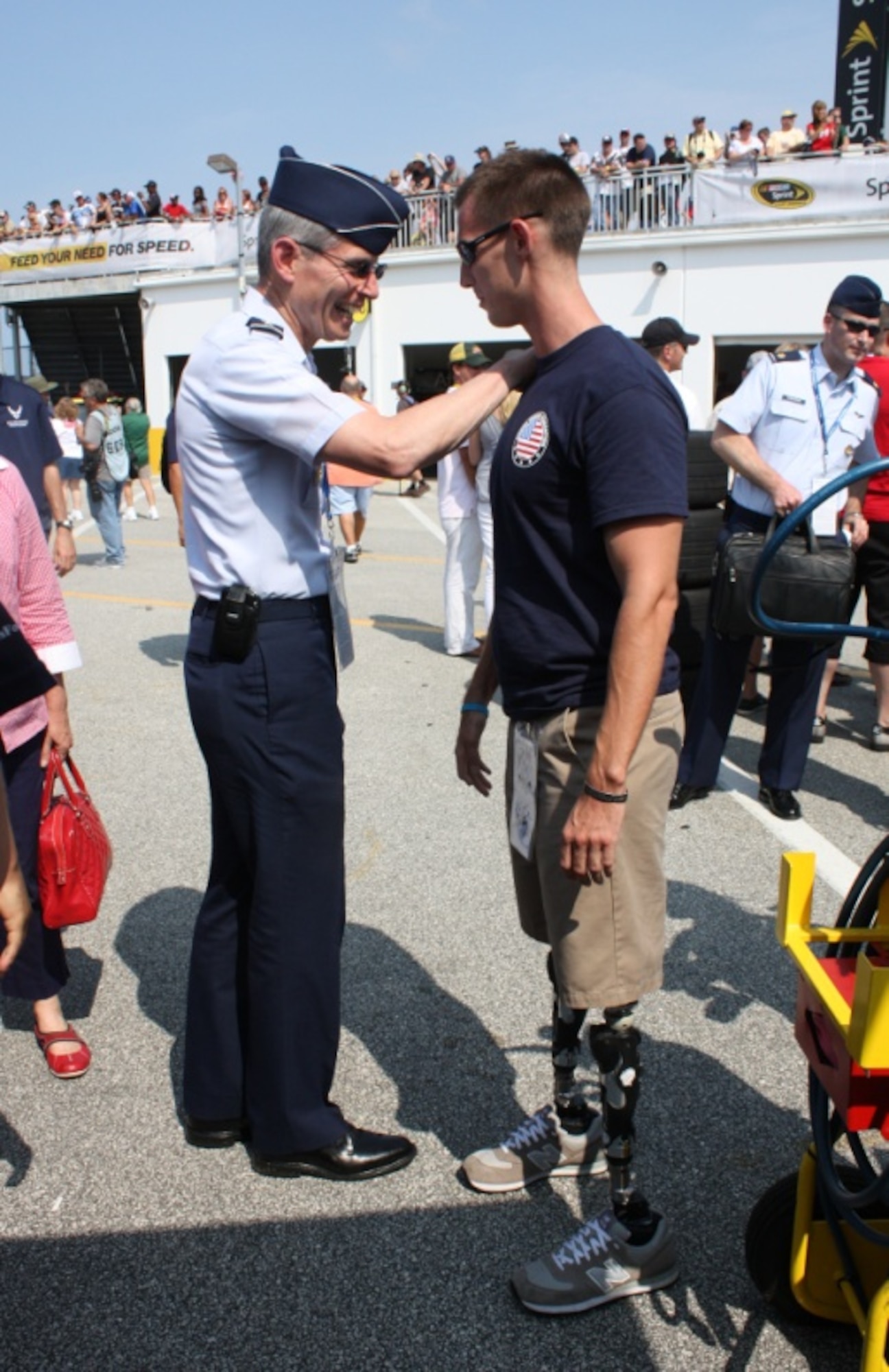 Air Force Chief of Staff Gen. Norton Schwartz takes a moment to visit with a Wounded Warrior July 2, 2011, at the Coke Zero 400 in Daytona Beach, Fla. (U.S. Air Force photo/Capt. Maggie M. Silva)