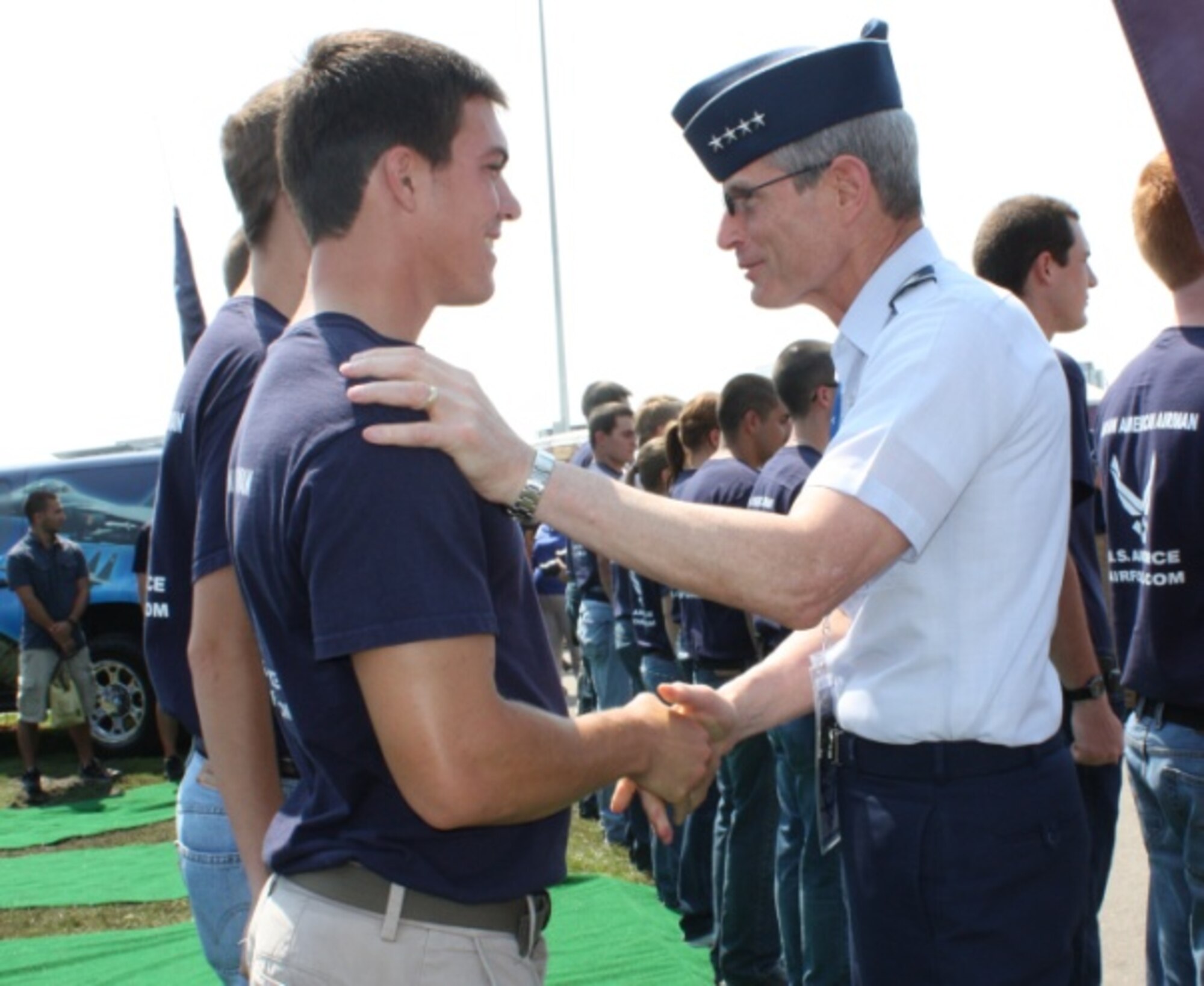 Air Force Chief of Staff Gen. Norton Schwartz shakes hands with delayed enlistment members after administering  the oath of enlistment July 2, 2011, at the Coke Zero 400 in Daytona Beach, Fla. (U.S. Air Force photo/Capt. Maggie M. Silva)
