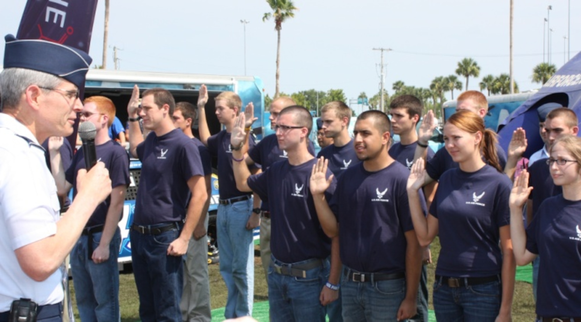 Twenty-four delayed enlisted members affirm their commitment to join the Air Force as Air Force Chief of Staff Gen. Norton Schwartz swears in the future Airmen July 2, 2011, at the Coke Zero 400 in Daytona Beach, Fla. (U.S. Air Force photo/Capt. Maggie M. Silva)