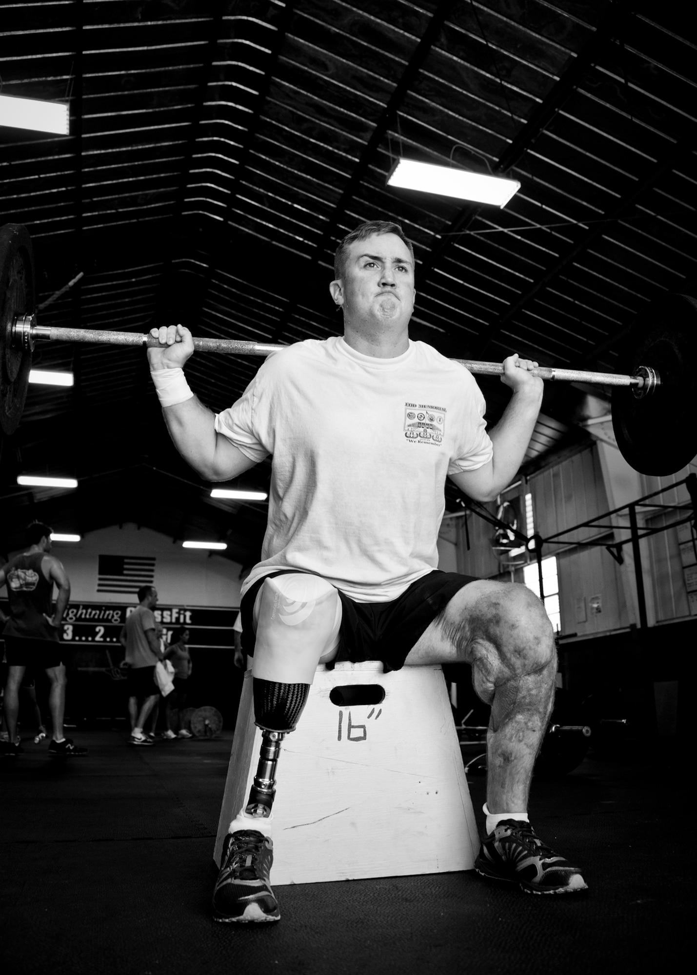 Staff Sgt. David Flowers adds weighted squats into his workout routine June 28, 2011, at Eglin Air Force Base, Fla.The explosive ordnance technician was officially returned to duty in June after he lost his right leg and incurred major damage to his left leg in a land mine explosion in Afghanistan in 2009. In August, he is scheduled to begin training to be an EOD instructor at the Navy EOD School. Flowers is assigned to 366th Training Squadron, Det. 3. (U.S. Air Force photo/Samuel King Jr.)