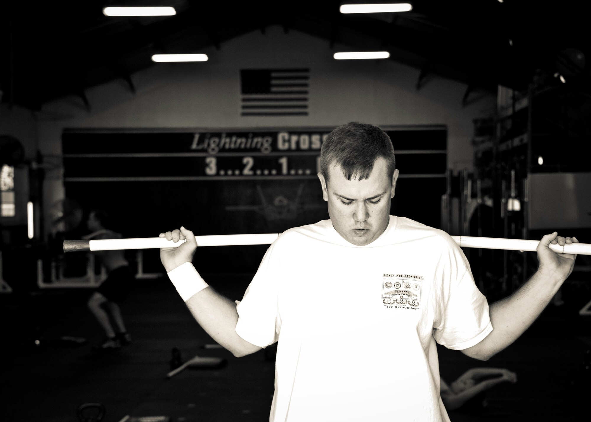 Staff Sgt. David Flowers warms up with some stretches before his workout June 28, 2011,at Eglin Air Force Base, Fla. The explosive ordnance technician was officially returned to duty in June after he lost his right leg and incurred major damage to his left leg in a land mine explosion in Afghanistan in 2009. In August, he is scheduled to begin training to be an EOD instructor at the Navy EOD School. Flowers is assigned to 366th Training Squadron, Det. 3. (U.S. Air Force photo/Samuel King Jr.)