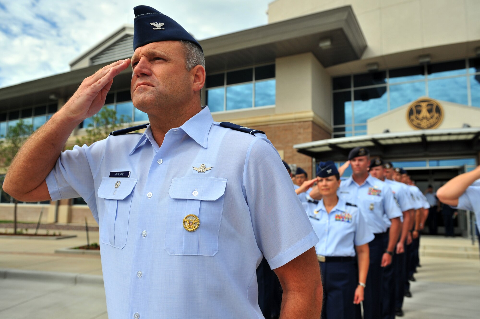 BUCKLEY AIR FORCE BASE, Colo. -- Colonel Trent Pickering, 460th Space Wing vice commander, presents the first salute to the incoming commander, Col. Daniel Dant (not shown), during an Assumption of Command ceremony July 11, 2011. (U.S. Air Force photo by Staff Sgt. Kathrine McDowell)