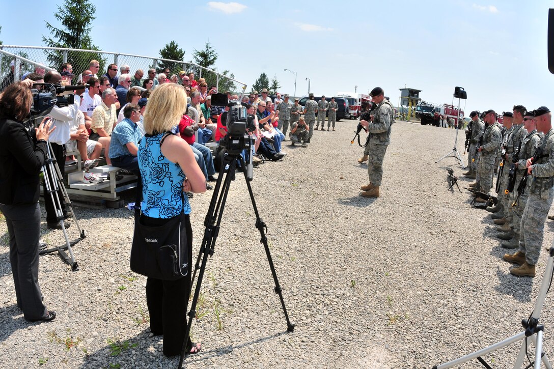 YOUNGSTOWN AIR RESERVE STATION, Ohio -- Members of the 910th Security Forces Squadron brief a group of civilian employers while reporters from the Youngstown-area media look on as part of the Air Force Reserve's 910th Airlift Wing's annual Employer Awareness Day here, July 10, 2011. The goal of the event is to increase the awareness of civilian employers to importance of the role Air Force Reservists have in the U.S. military. U.S. Air Force photo by Tech. Sgt. James Brock